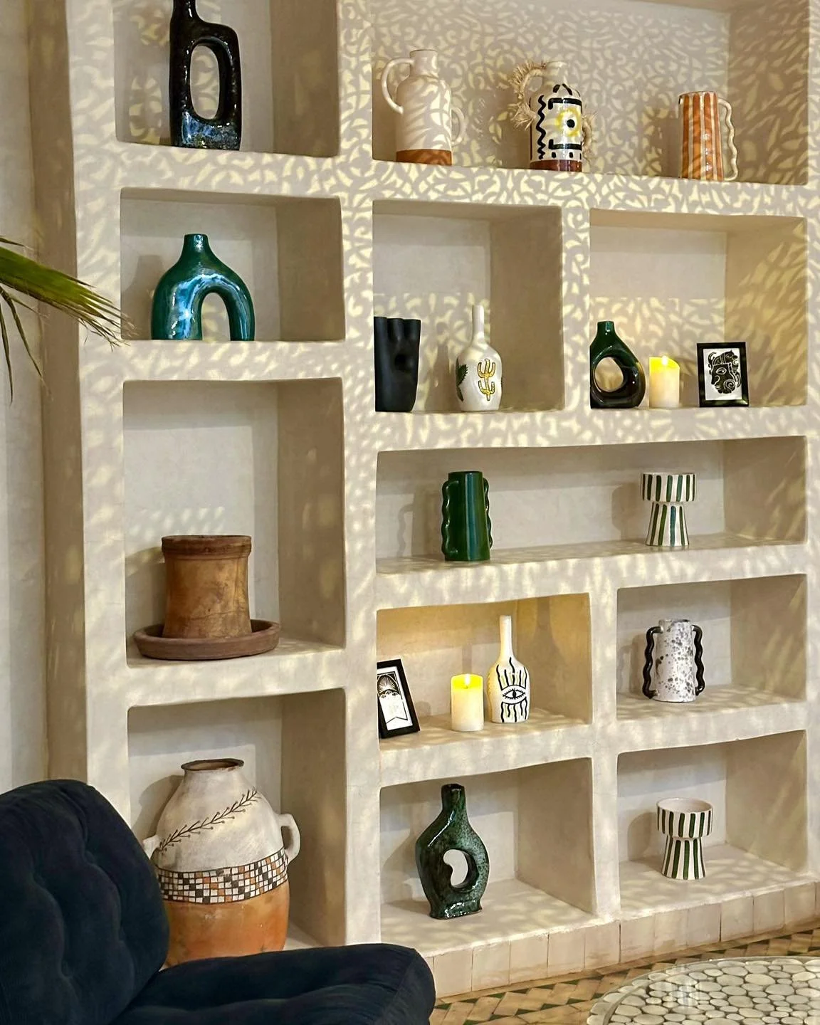 The glow of the lights reveals patterns and textures on the walls.
Each piece on these shelves was chosen with care &mdash; blending Moroccan tradition with a touch of contemporary design.
A quiet elegance that defines the spirit of El Badun.
#riadel