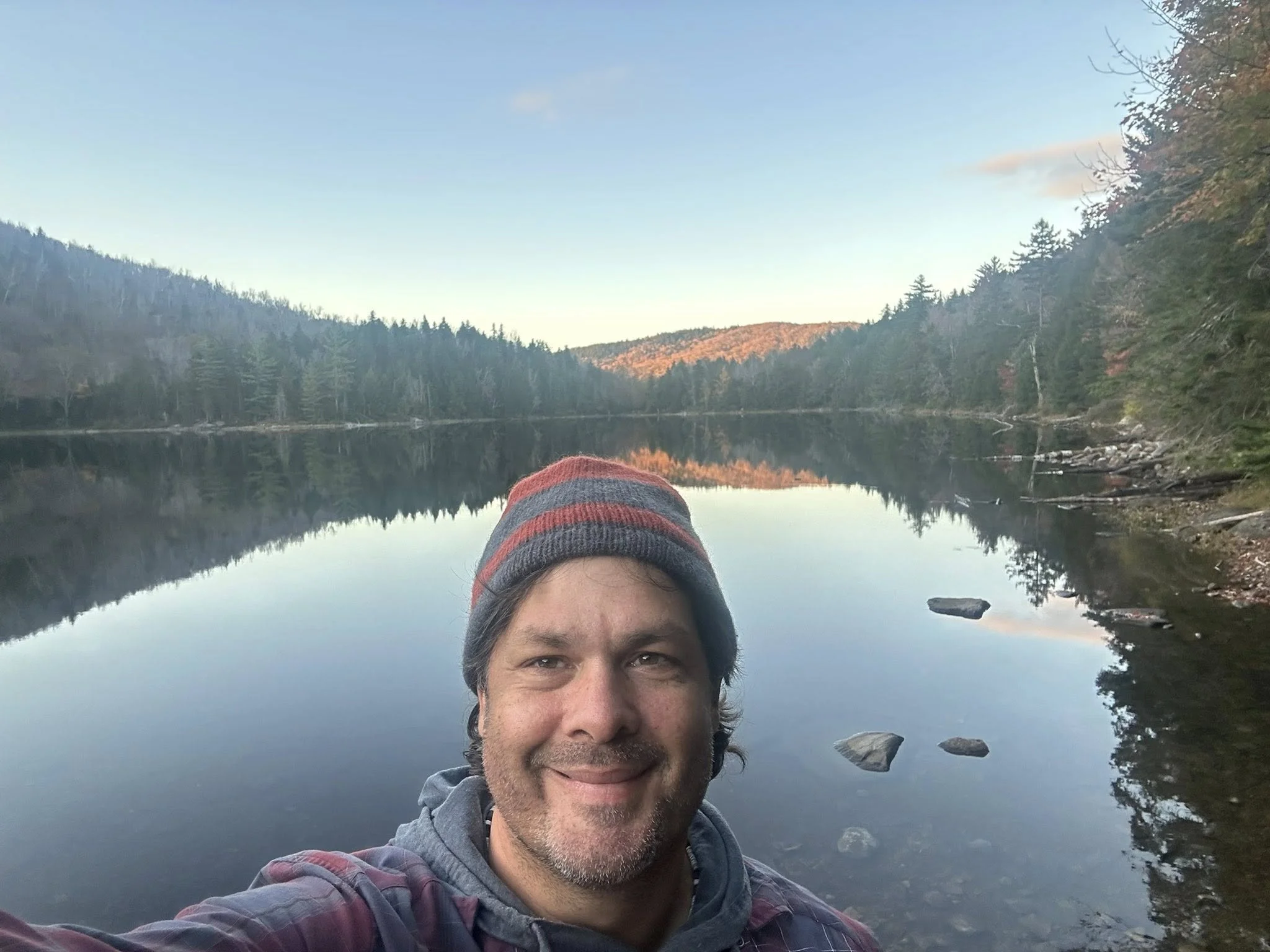 Matt Miale taking a selfie while on a calm lake. Matt's favorite place is anywhere outdoors