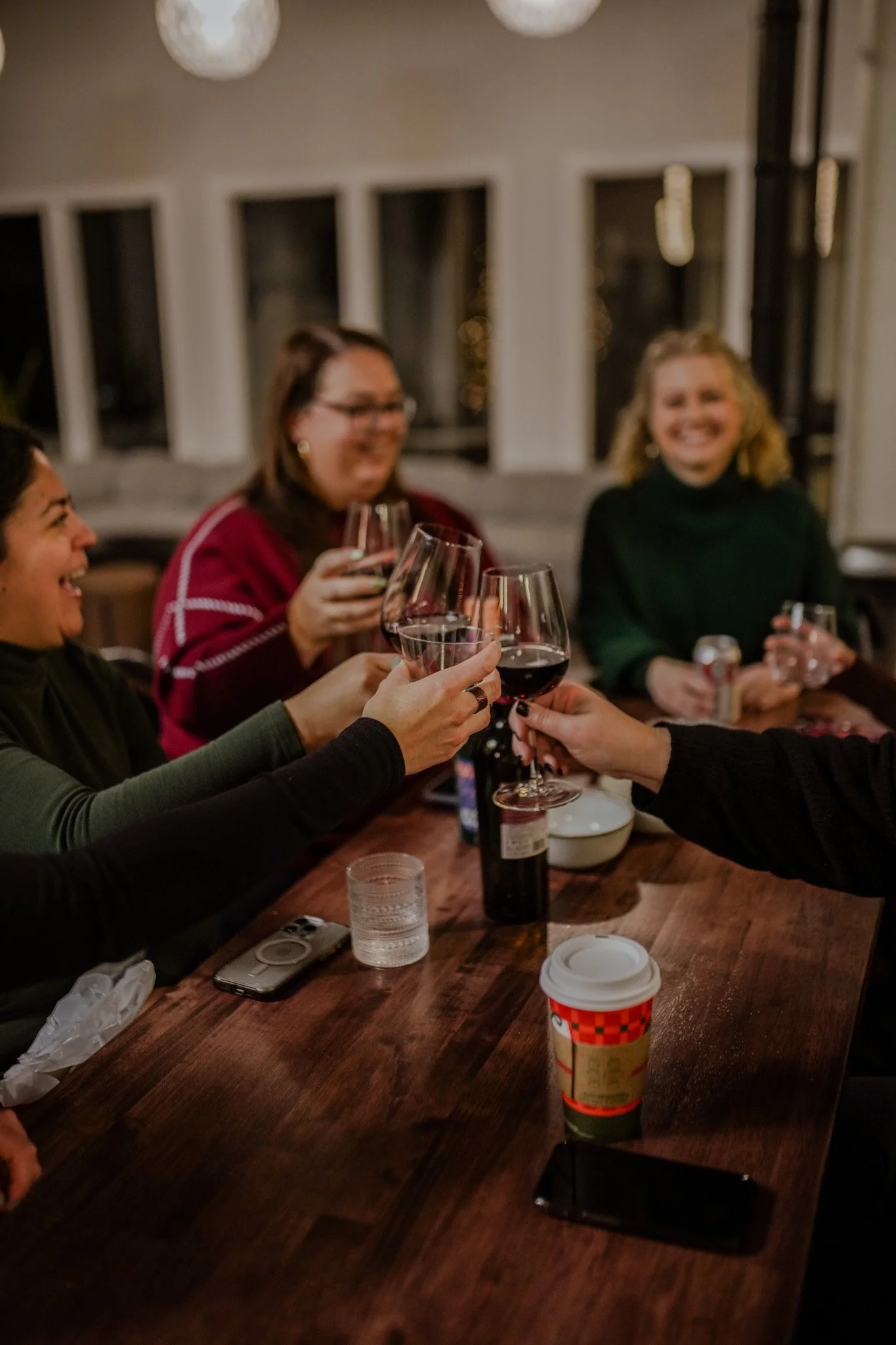 Members raising glasses around a long table