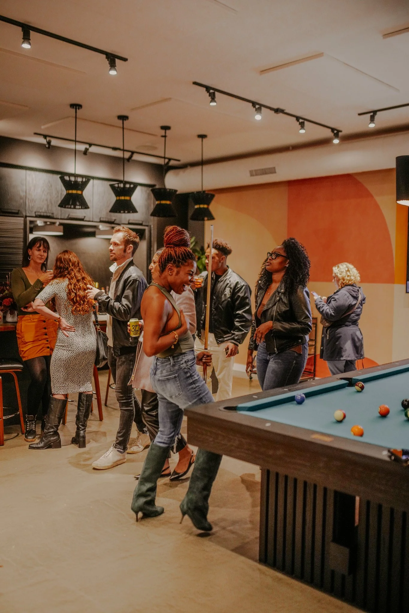 Members mingling at the Three Cities Social clubhouse