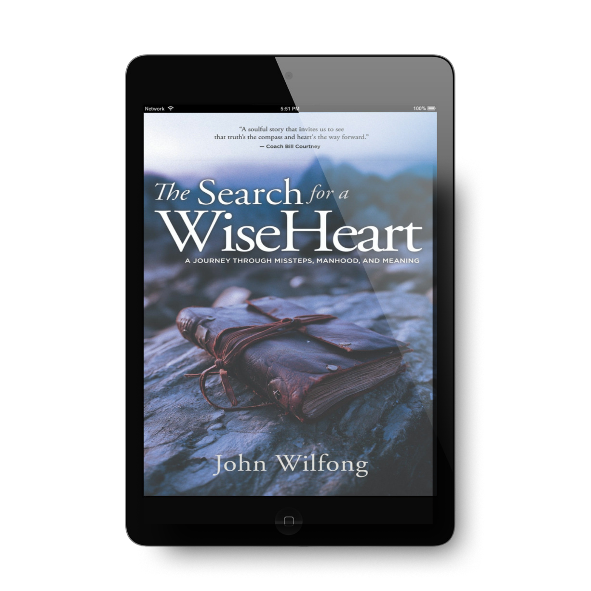 E-book cover titled 'The Search for a Wise Heart' by John Wilfong, showing a leather-bound journal on rocks near water.