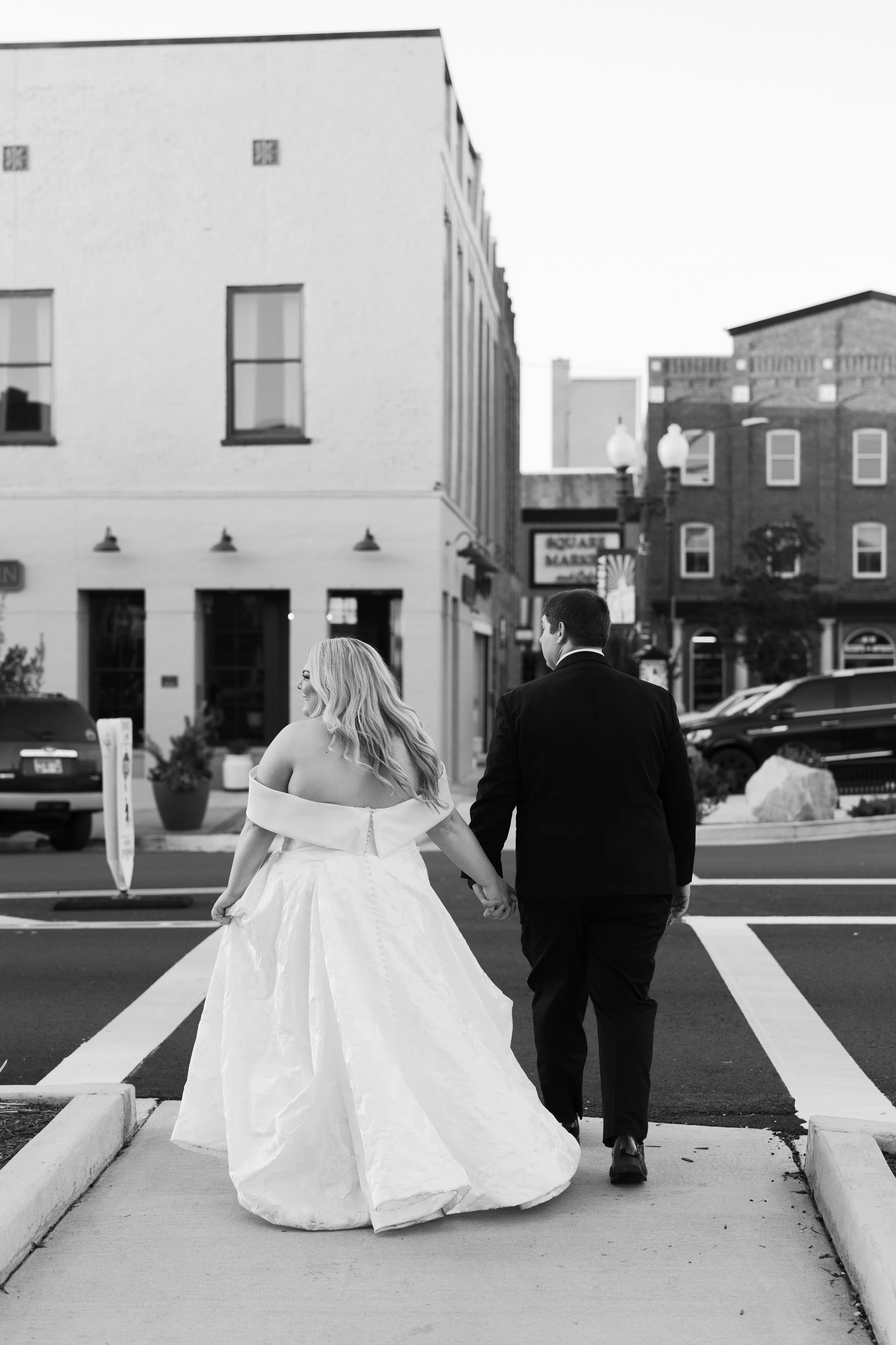 couple walking during portraits — natural moment West Tennessee wedding
