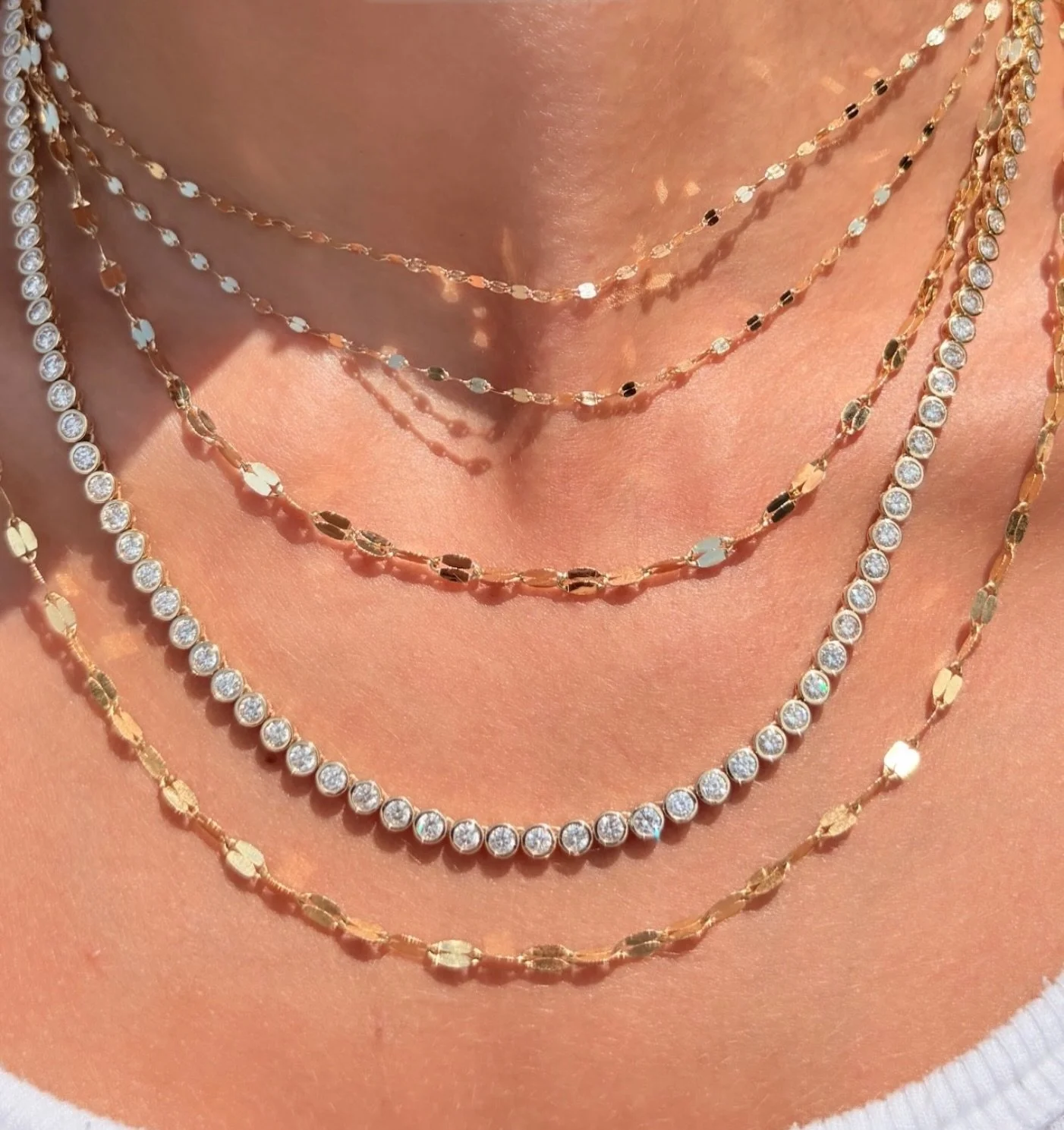 Layered in Glimmer &amp; Gold ✨✨ ask for our iconic Romey Disk chain in store &amp; choose from various lengths!

#stack #necklaces #beauty
