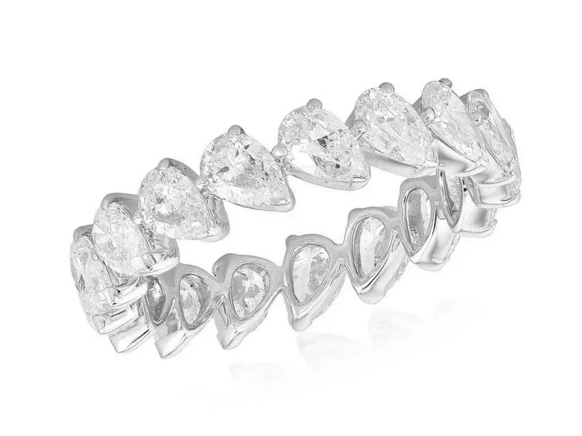 Silver ring with heart-shaped and round clear gemstones set in a repeating pattern.