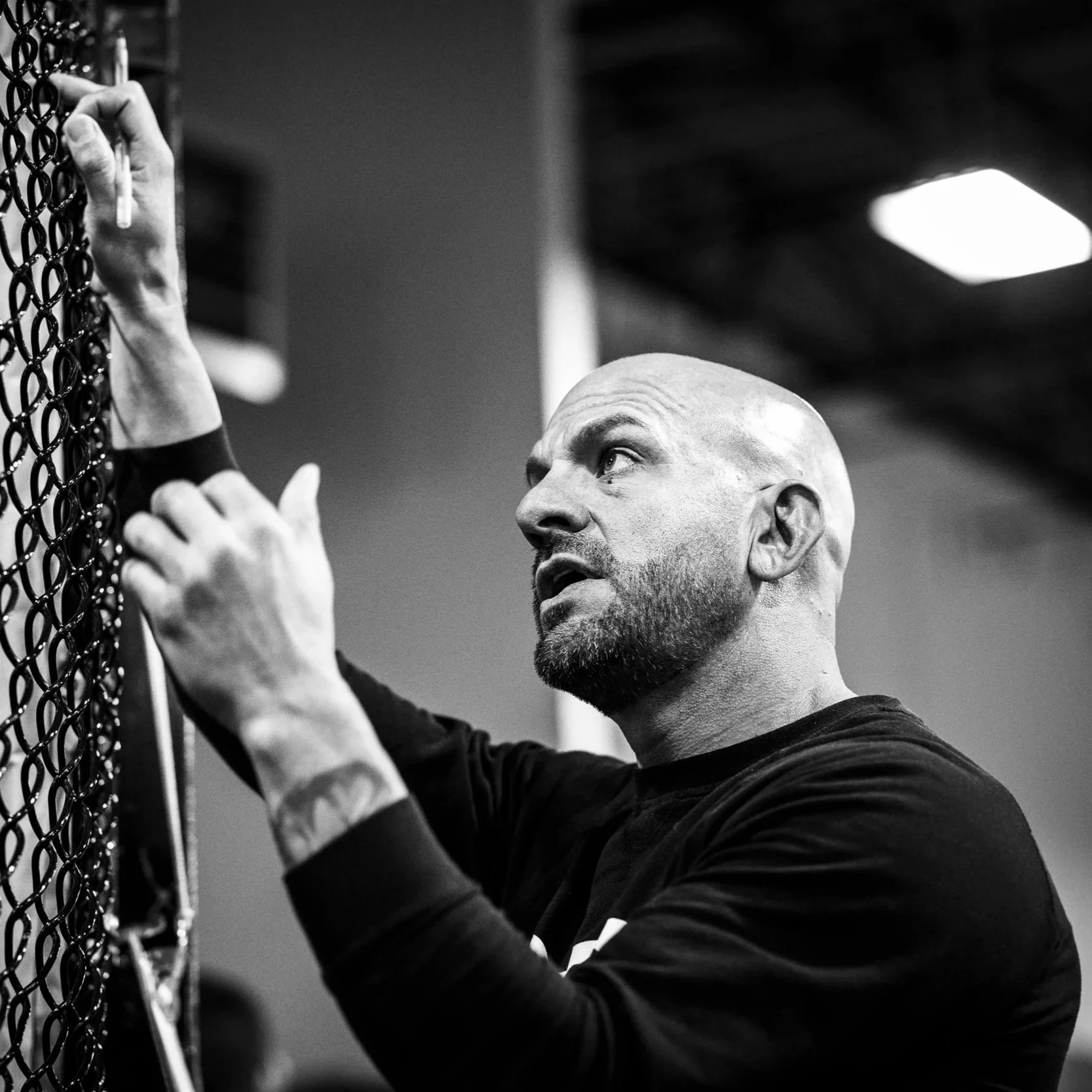 Coach Marc Montoya coaching cage-side at Factory X in Englewood, Colorado.