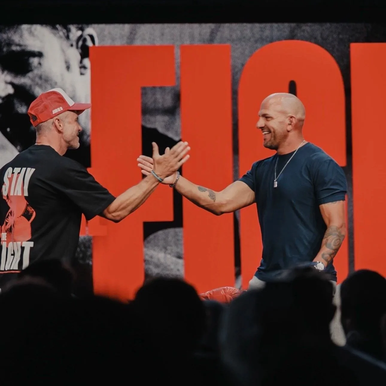 Pastor Shawn Johnson and Coach Marc Montoya on stage at the Red Rocks Church “Stay in the Fight” Men’s Conference in Austin, Texas.