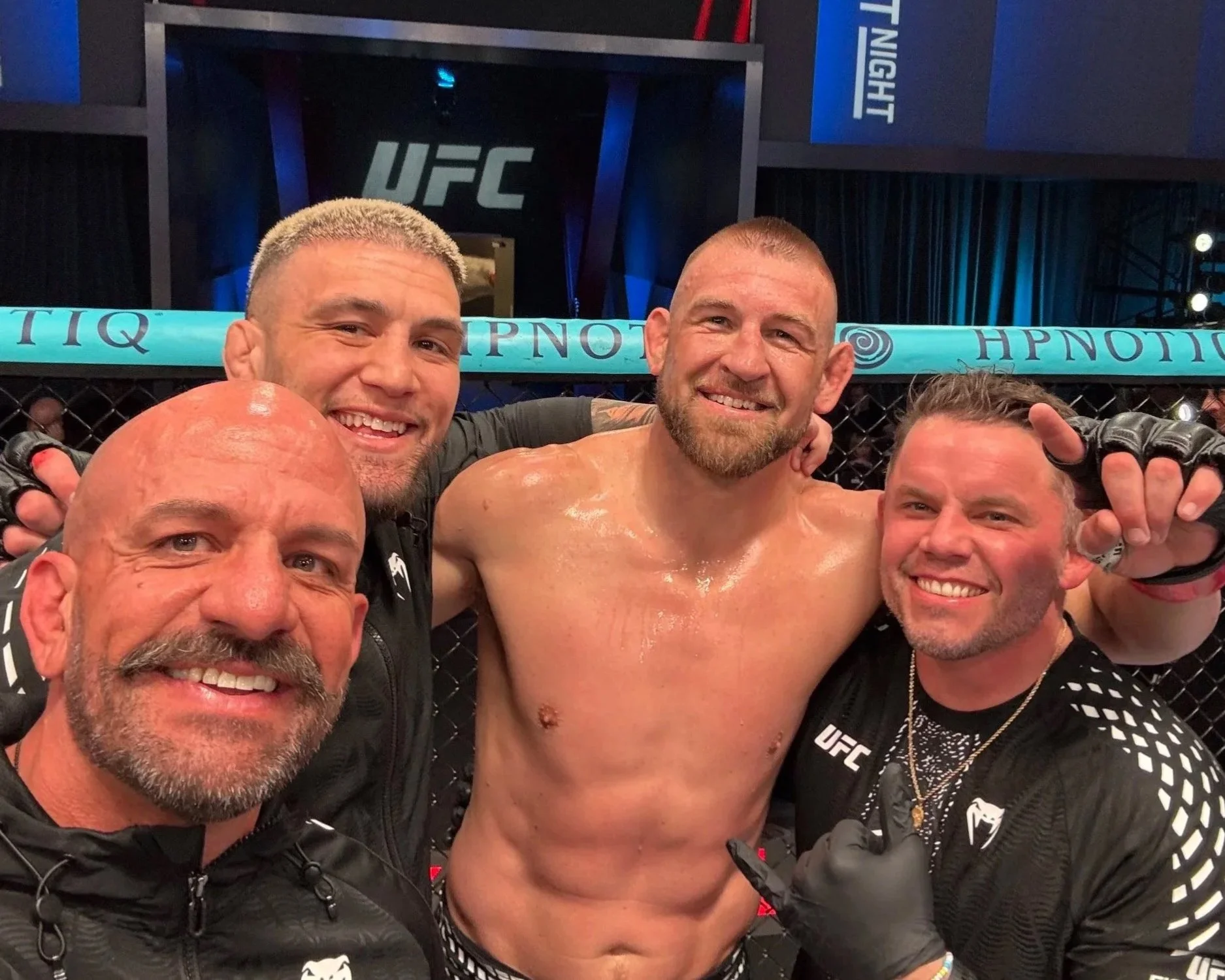Coach Marc Montoya, UFC fighter Cody Brundage and corner Randy Caruso taking a selfie with UFC fighter Dustin Jacoby after a win.