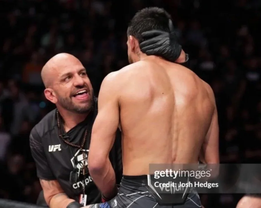 Coach Marc Montoya congratulating UFC fighter Chris “El Guapo” Gutierrez after a dominant UFC win.