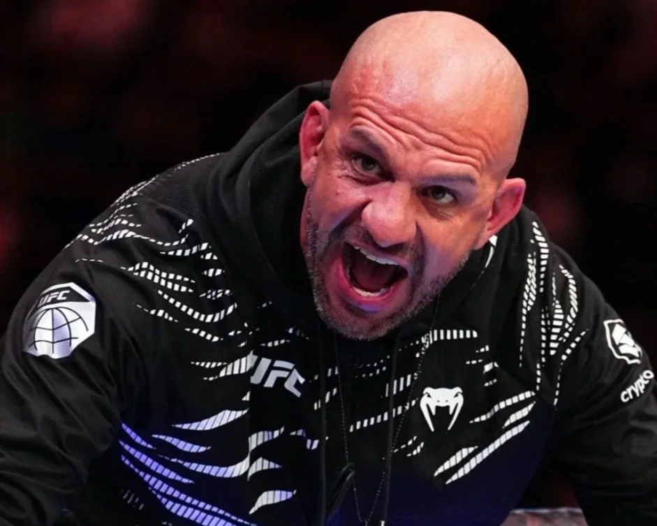 Coach Marc Montoya jumping on the Octagon following a UFC win.
