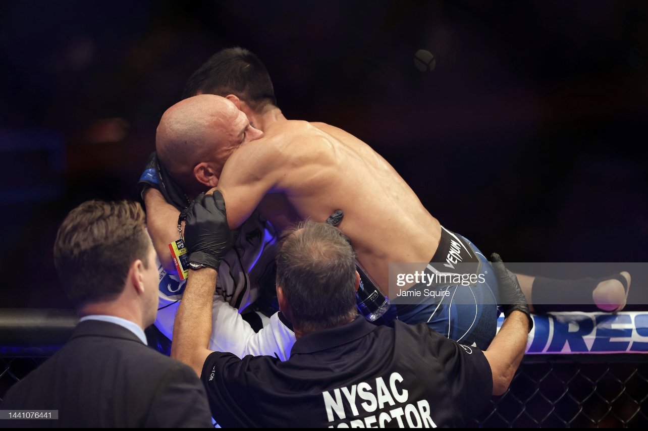 Coach Marc Montoya and UFC fighter Chris “El Guapo” Gutierrez embracing in the UFC octagon after knocking out Frankie Edgar in his retirement fight at Madison Square Garden in New York City, NY, November, 2022.