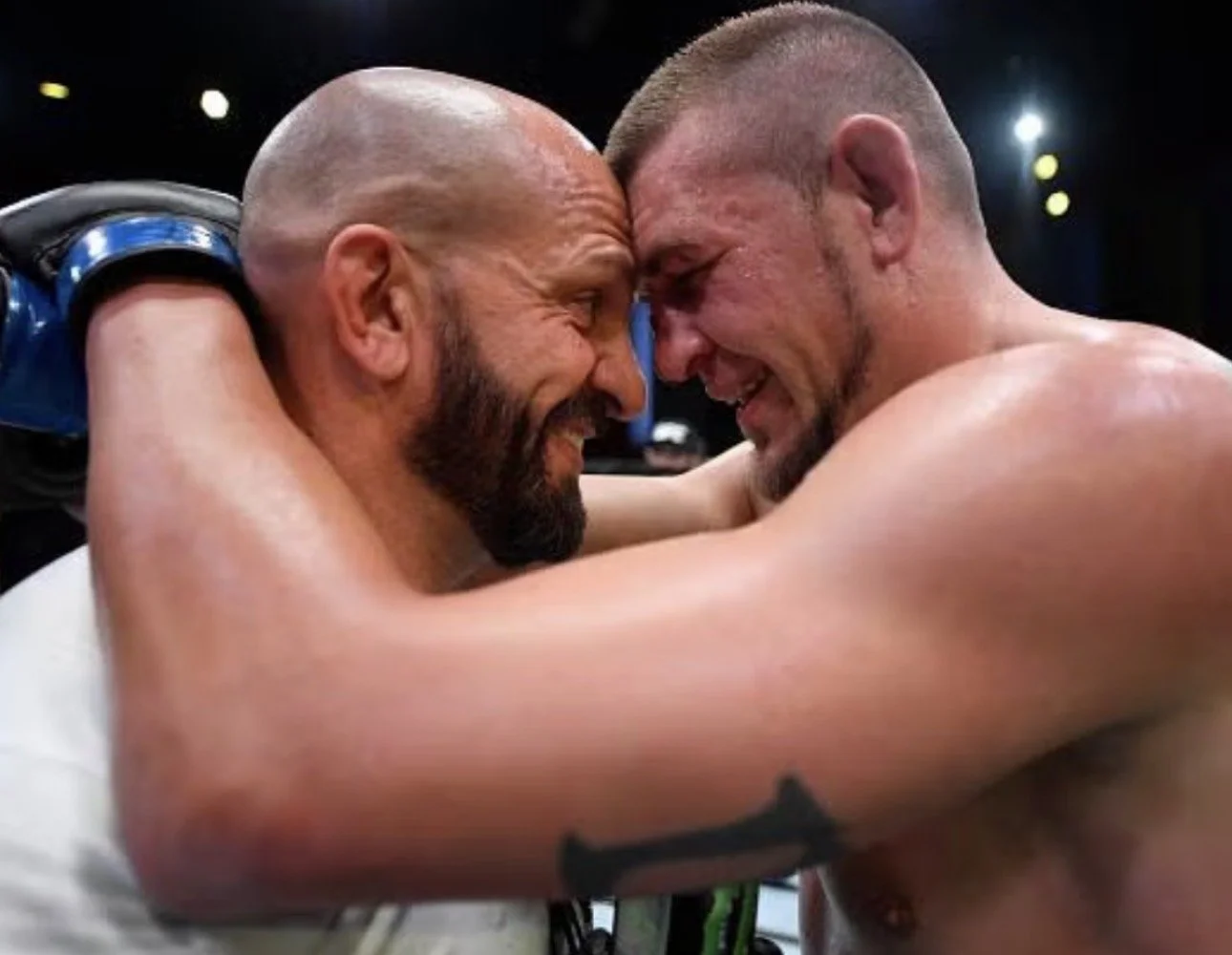 Coach Marc Montoya and UFC fighter Dustin Jacoby after winning a UFC fight.