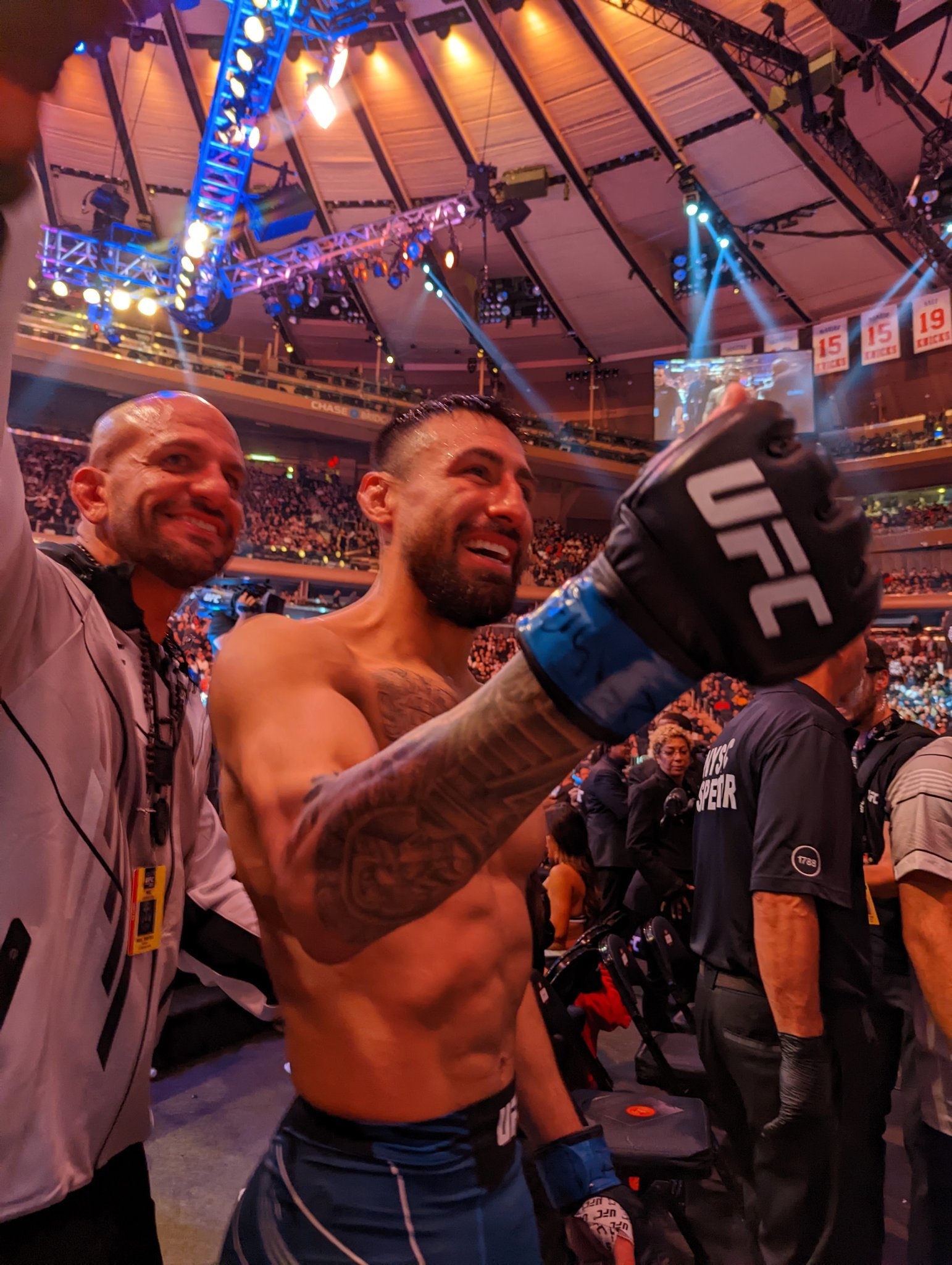 Coach Marc Montoya and UFC fighter Chris “El Guapo” Gutierrez leaving the UFC octagon after knocking out Frankie Edgar in his retirement fight at Madison Square Garden in New York City, NY, November, 2022.