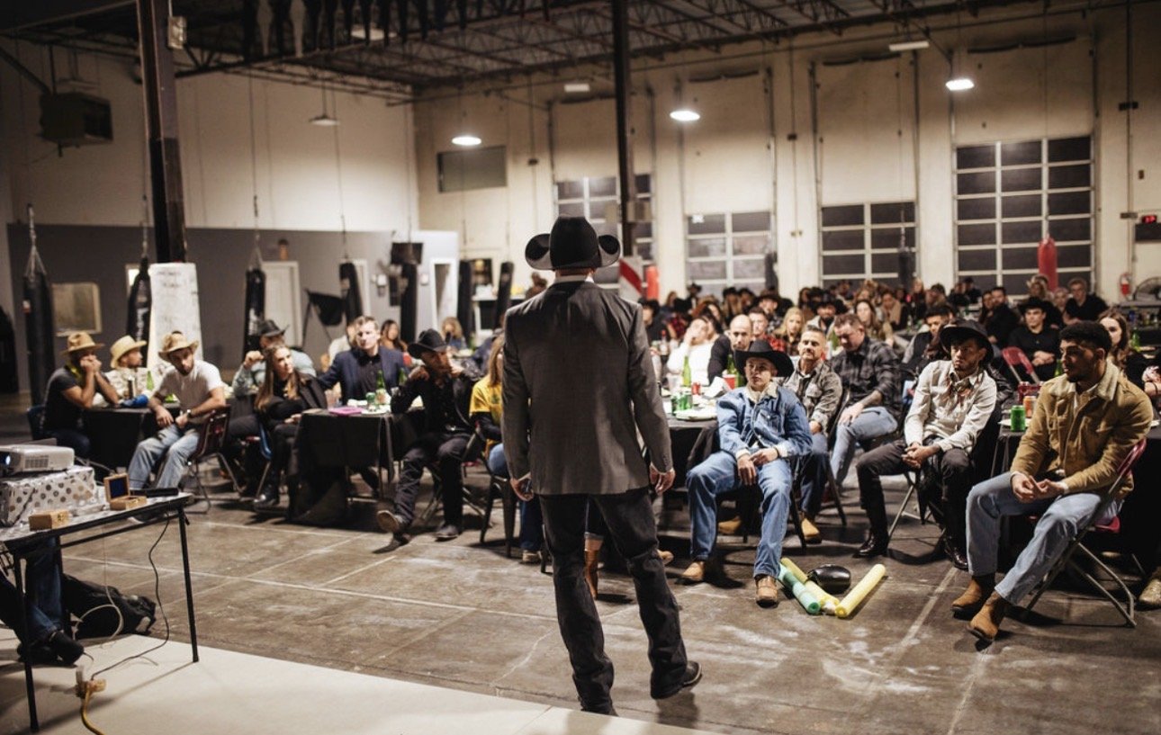 Coach Marc Montoya addressing the crowd at a speaking engagement at Factory X, Englewood, Colorado