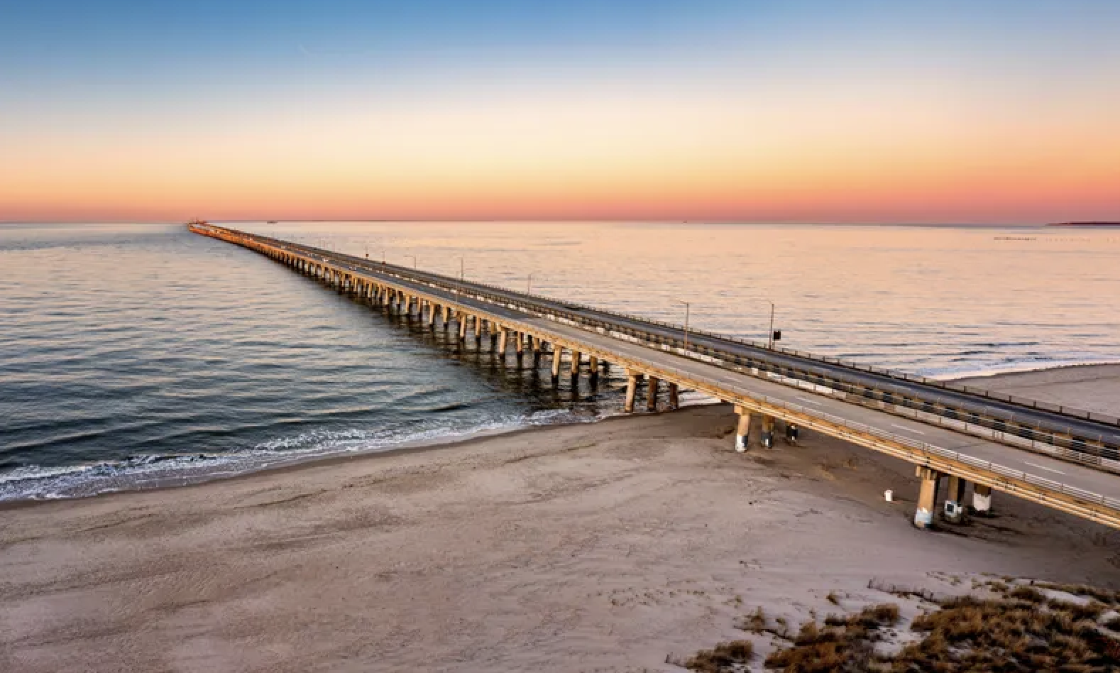 Chesapeake Bay Bridge-Tunnel at sunset from Chic's Beach, Virginia Beach, Fat Cat pool cleaning service area