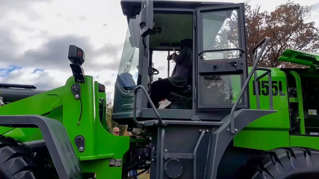 An attendee at the event riding the loader