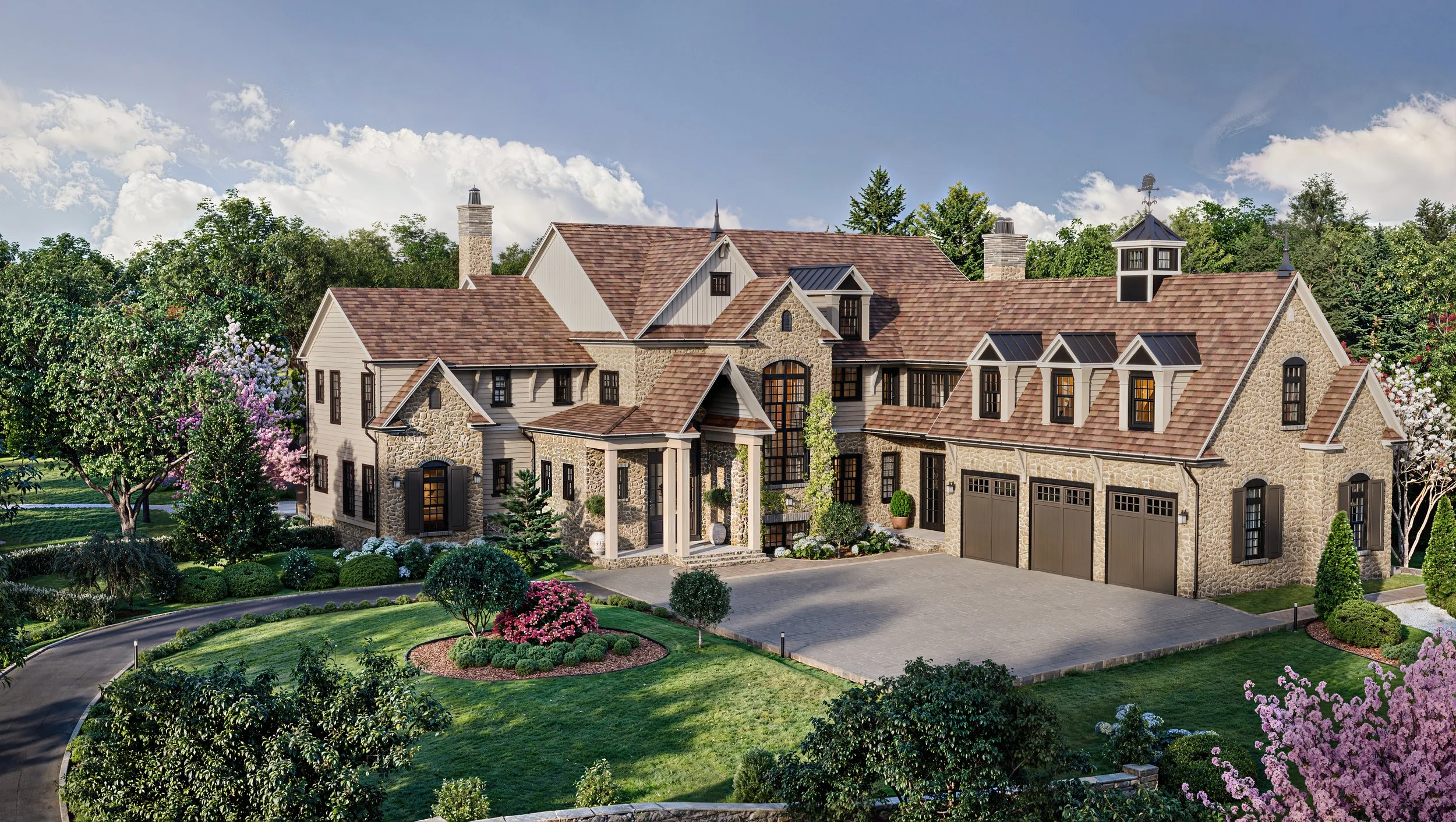 Large upscale house with stone and siding exterior, multiple gabled roofs, and a three-car garage. Surrounded by landscaped lawn and flowering trees.