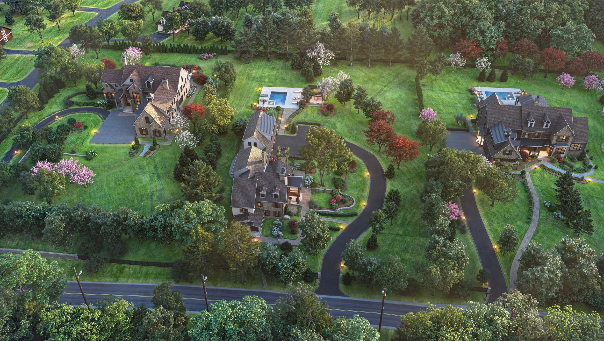 An aerial view of a residential neighborhood with large houses, lush green lawns, and trees, featuring a central private pool with lounge chairs, and winding roads through the greenery.