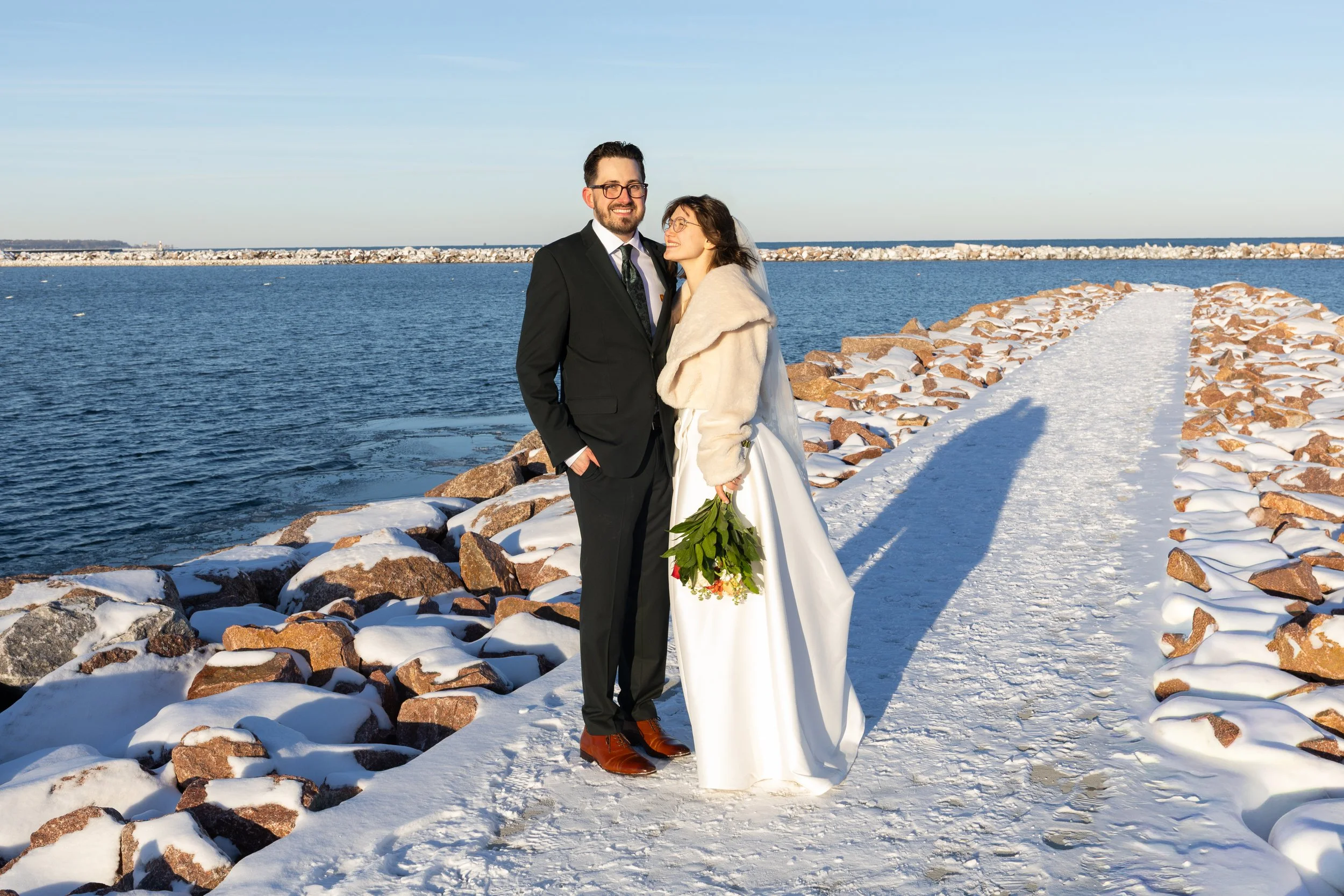 bride and groom on the Milwaukee lakefront at their winter wedding