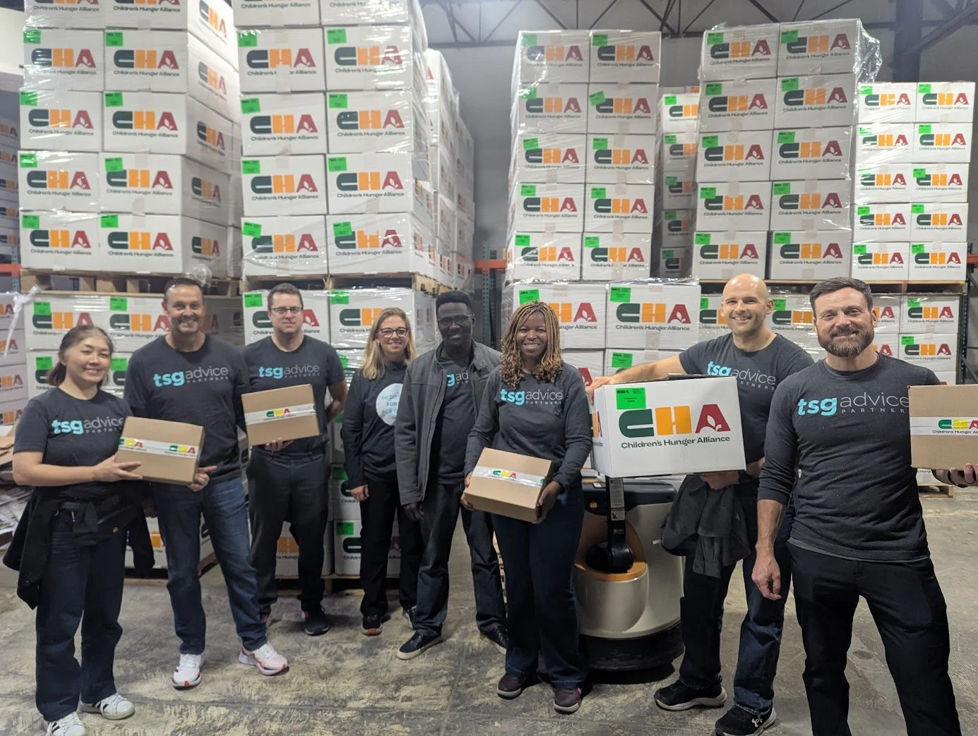 Asendo Team assembling meal boxes for the Child Hunger Alliance