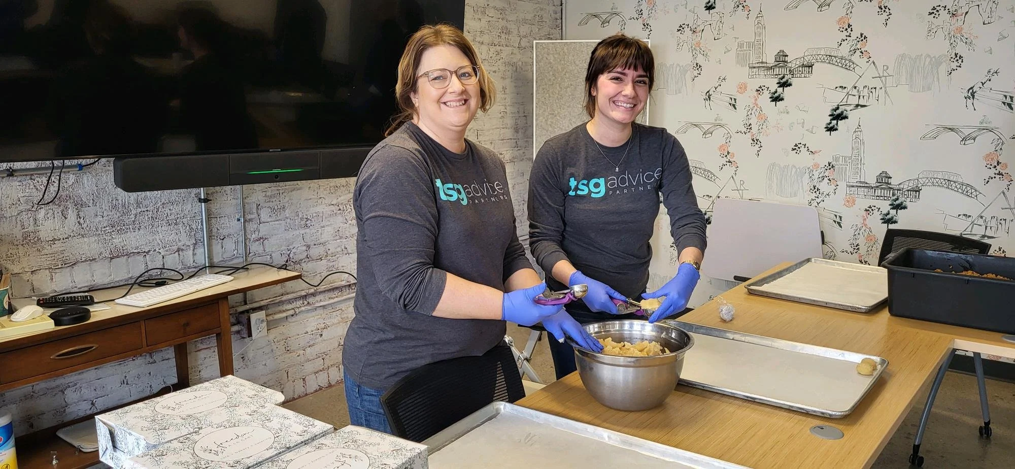 Asendo Team prepping holiday baked goods for Freedom ala cart's annual Cause Cookies event.