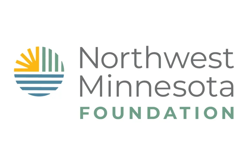 Logo of Northwest Minnesota Foundation featuring a stylized sun and water scene next to the text 'Northwest Minnesota Foundation'