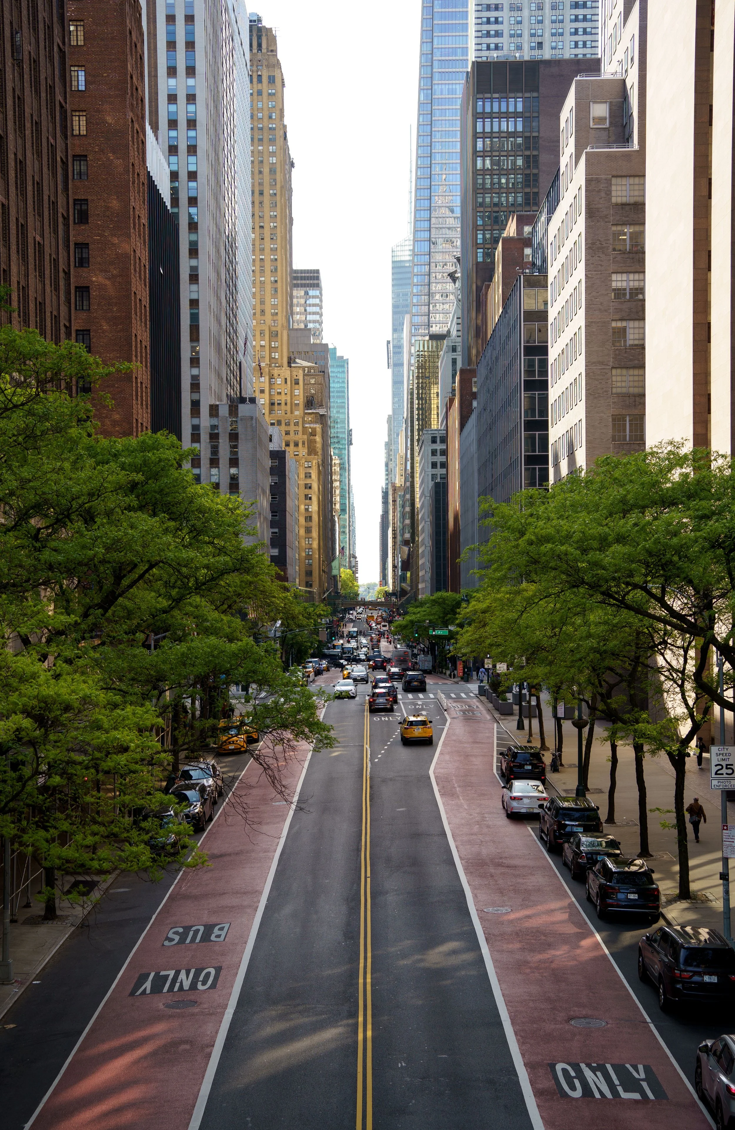 A quiet New York City street stretching toward the horizon — the city first responders protect every day.