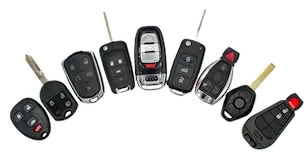 Collection of car key fobs with buttons for lock, unlock, and trunk release