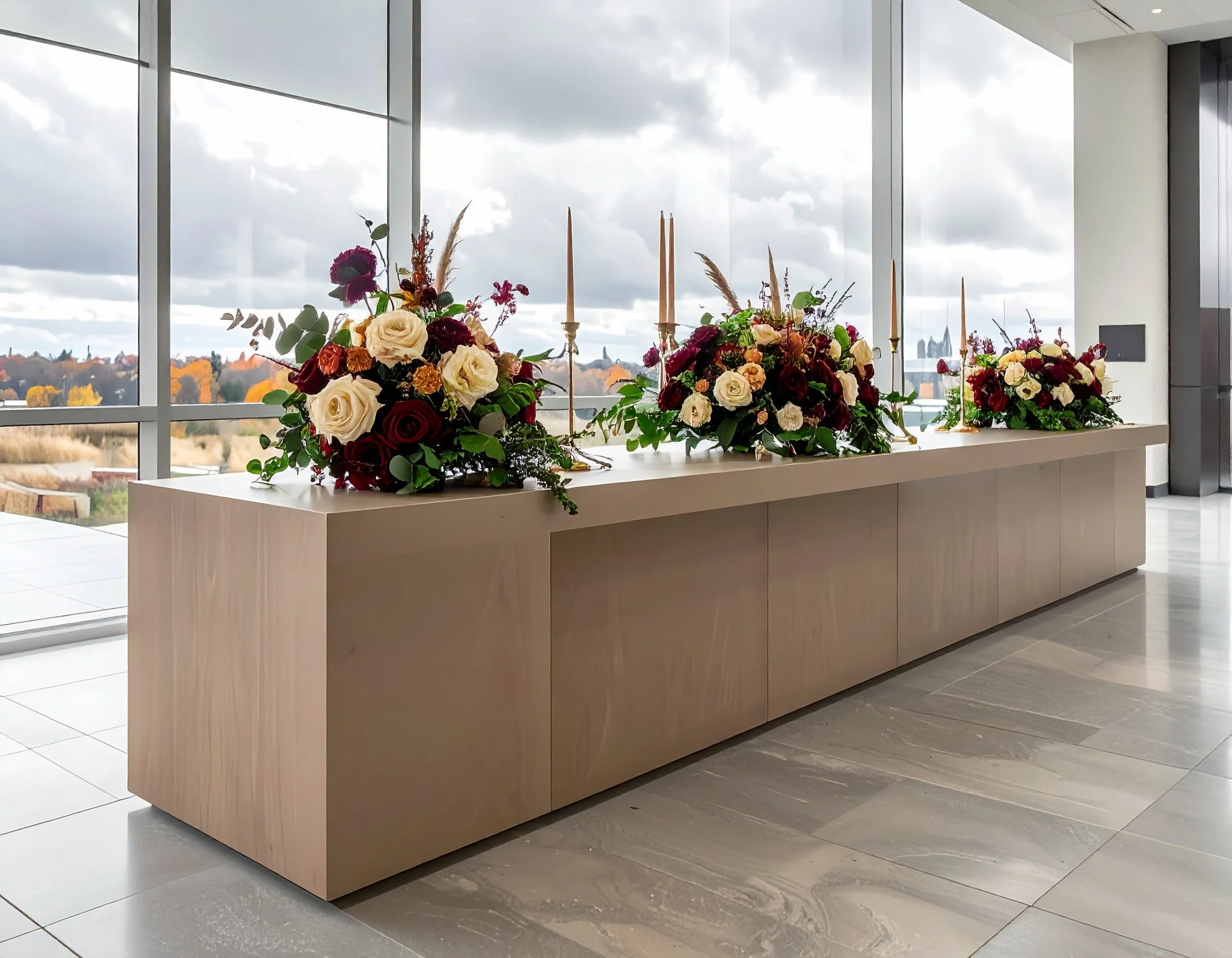 Firefly_Fall tablescape installation in a corporate lobby, long table with cut flower arrange 460806.jpg