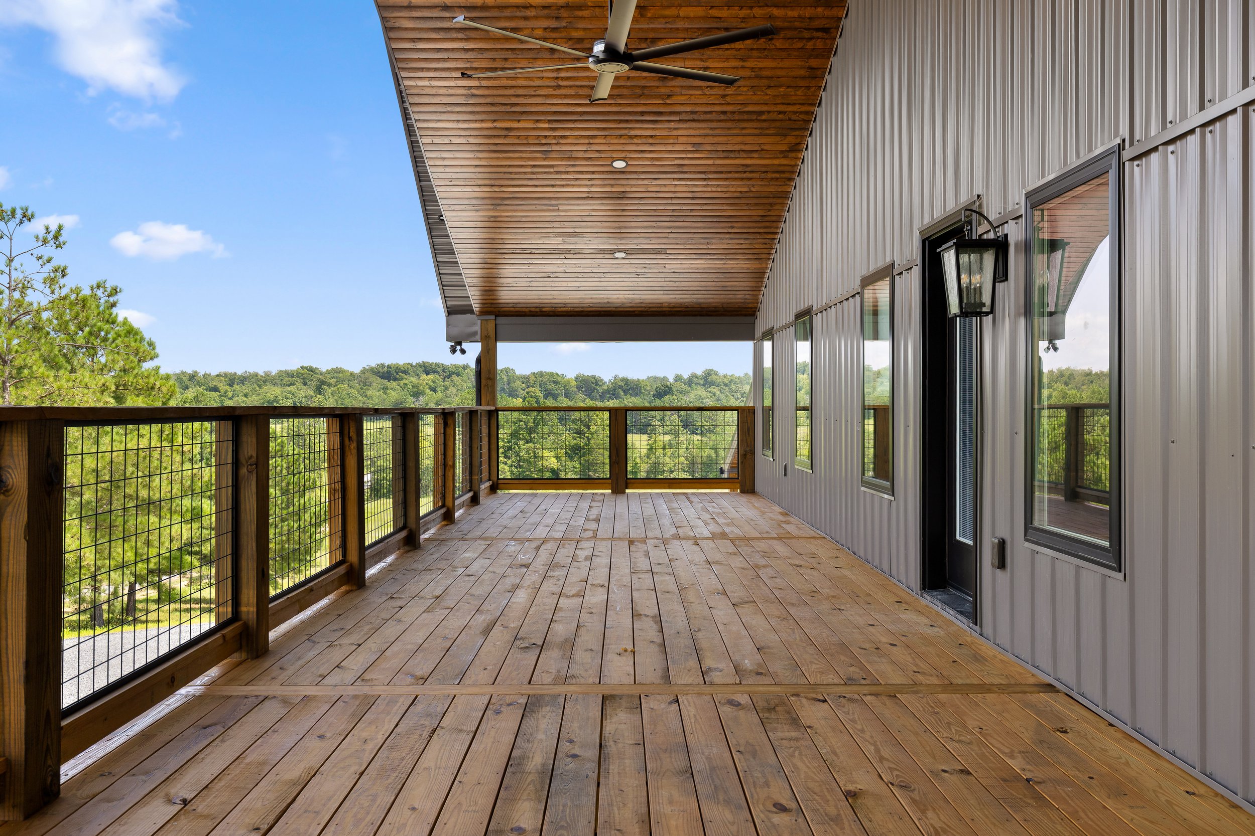 custom-barndominium-exterior-lighthouse-construction-deck.jpg