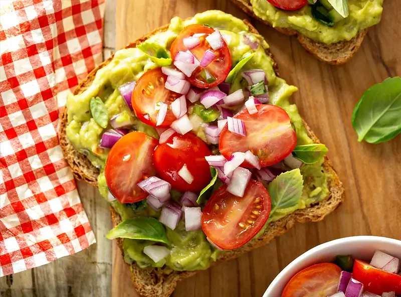 Avocado toast with tomatoes and onion