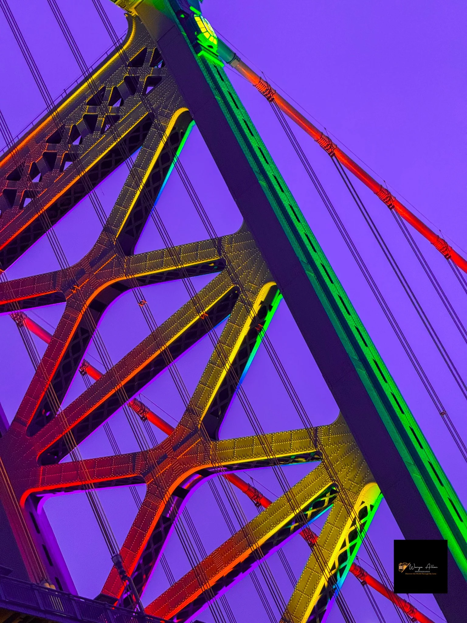 A Beacon of Pride: The Benjamin Franklin Bridge Illuminated in Rainbow Glory