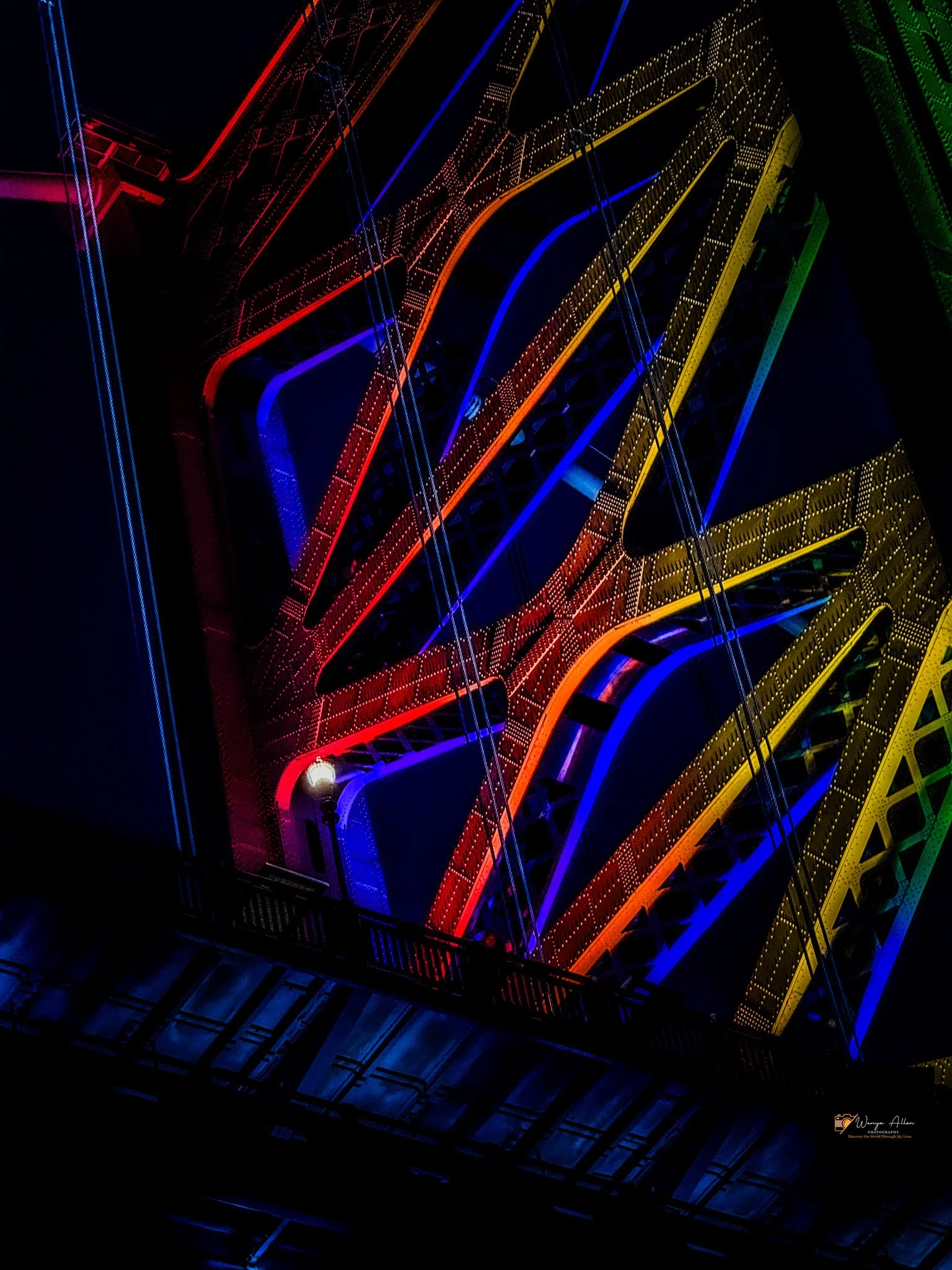 A Beacon of Pride: The Benjamin Franklin Bridge Illuminated in Rainbow Glory