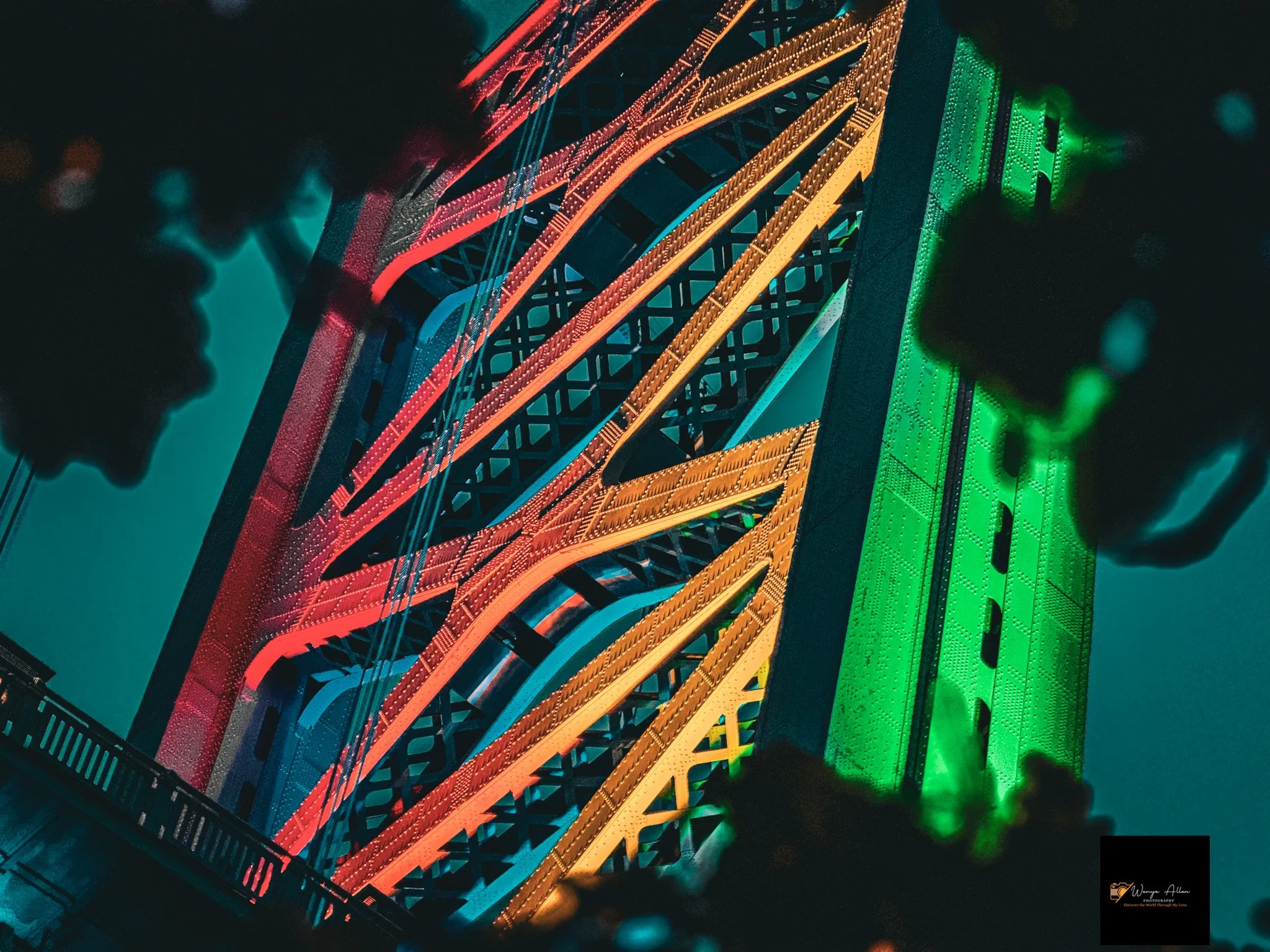 A Beacon of Pride: The Benjamin Franklin Bridge Illuminated in Rainbow Glory