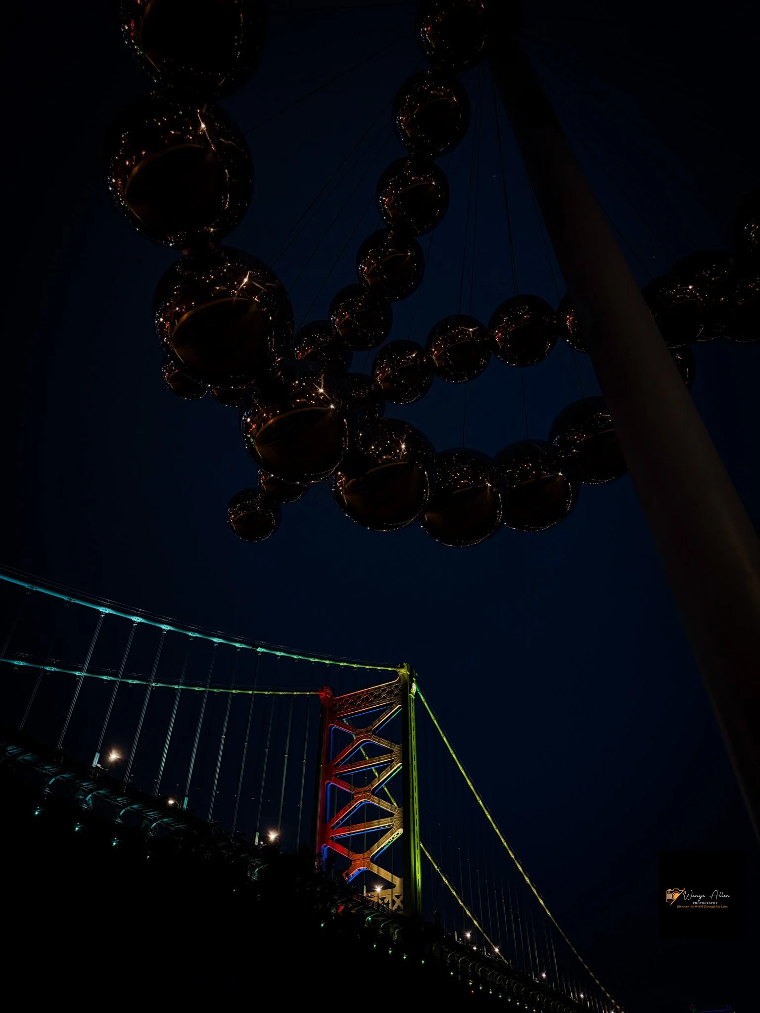 A Beacon of Pride: The Benjamin Franklin Bridge Illuminated in Rainbow Glory