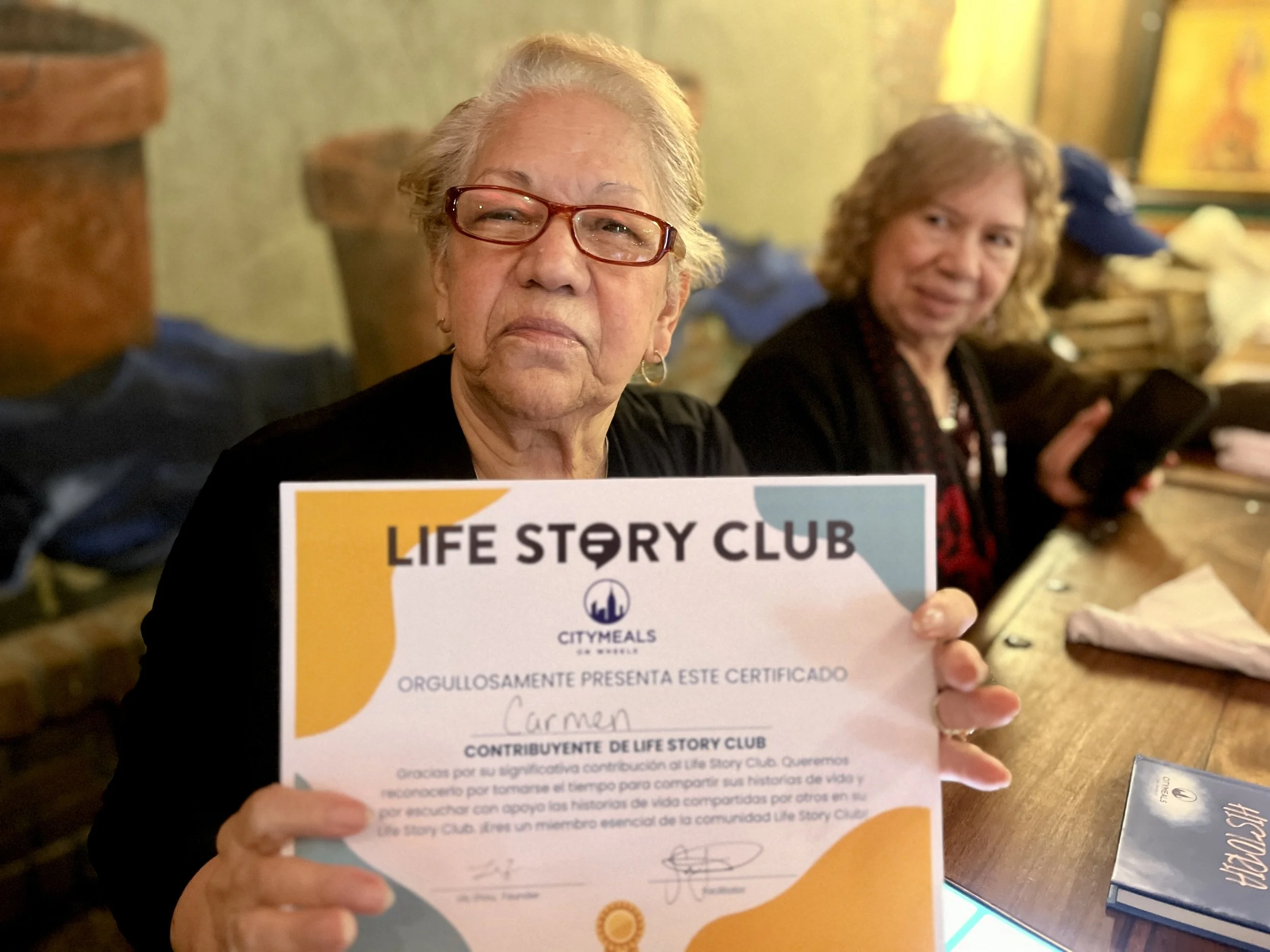 Carmen Flores with certificate.jpg