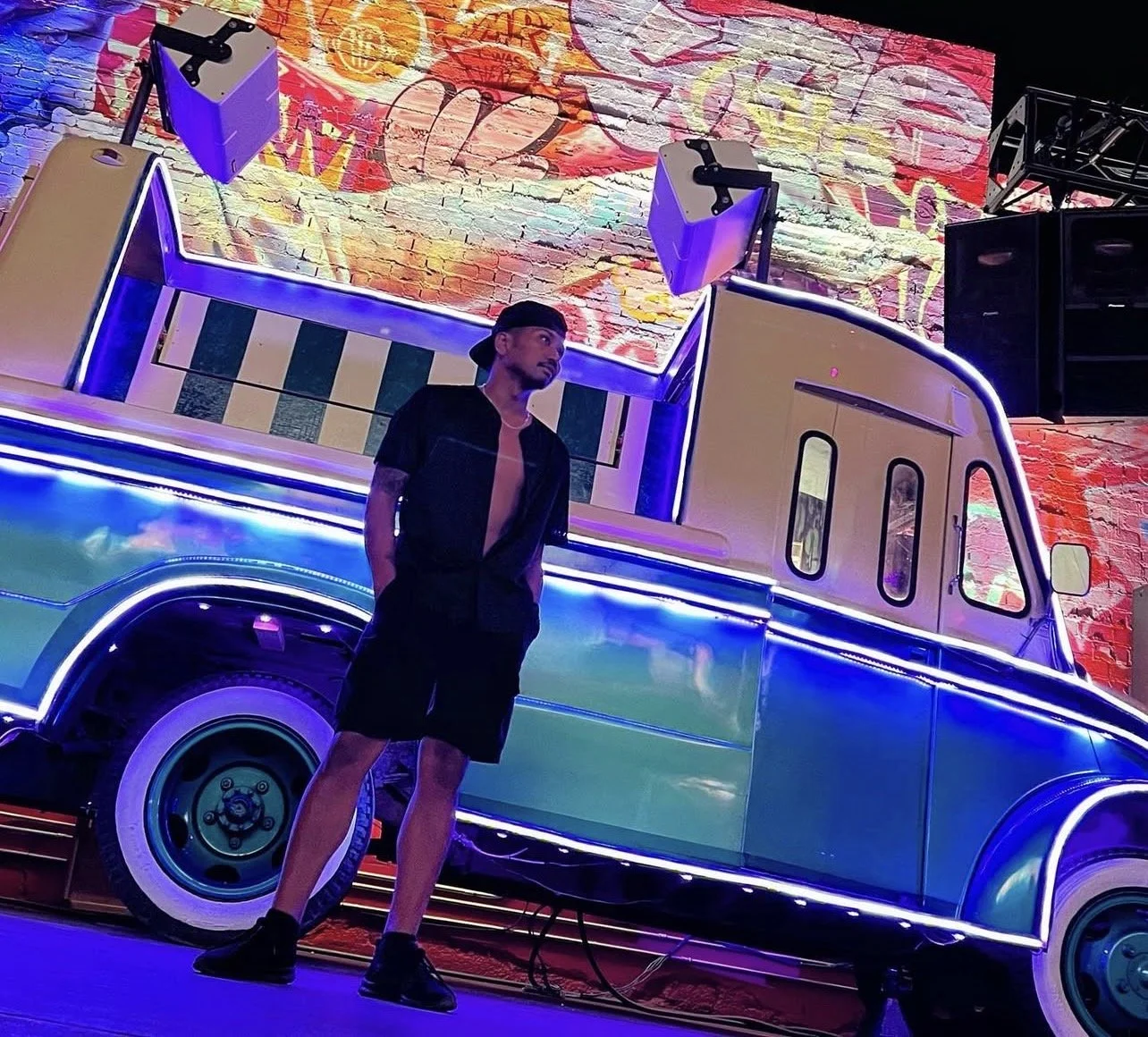 Xander Duff photographed in front of a colorful neon art installation, showcasing his lifestyle and creative energy. As a digital marketing strategist, entrepreneur, and media personality, Xander Duff shares his journey, projects, and experiences on 