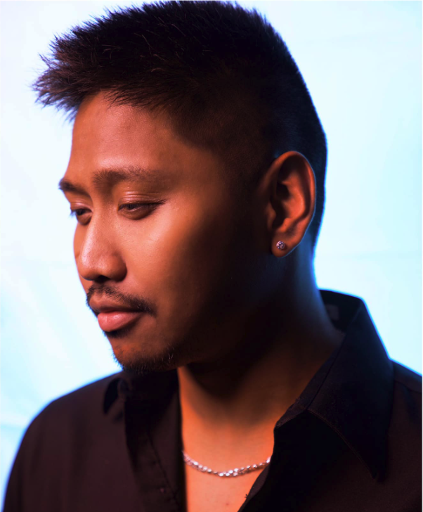 Studio portrait of Xander Duff captured with dramatic lighting and modern editorial styling. This image reflects the creative identity of Xander Duff as a marketing strategist, performer, and digital creator featured throughout his personal website x