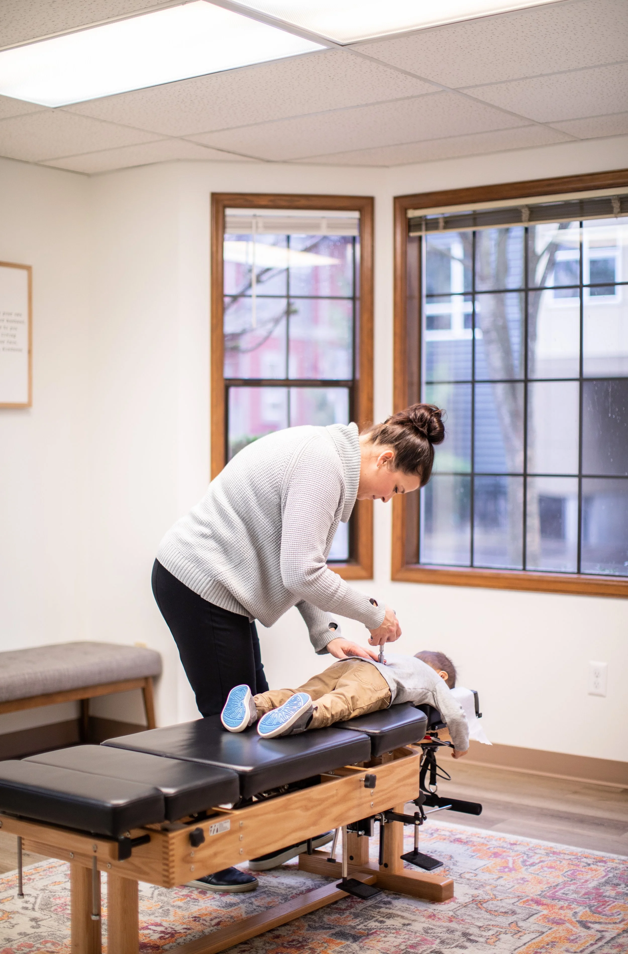 pediatric chiropractor adjusting child in Redmond