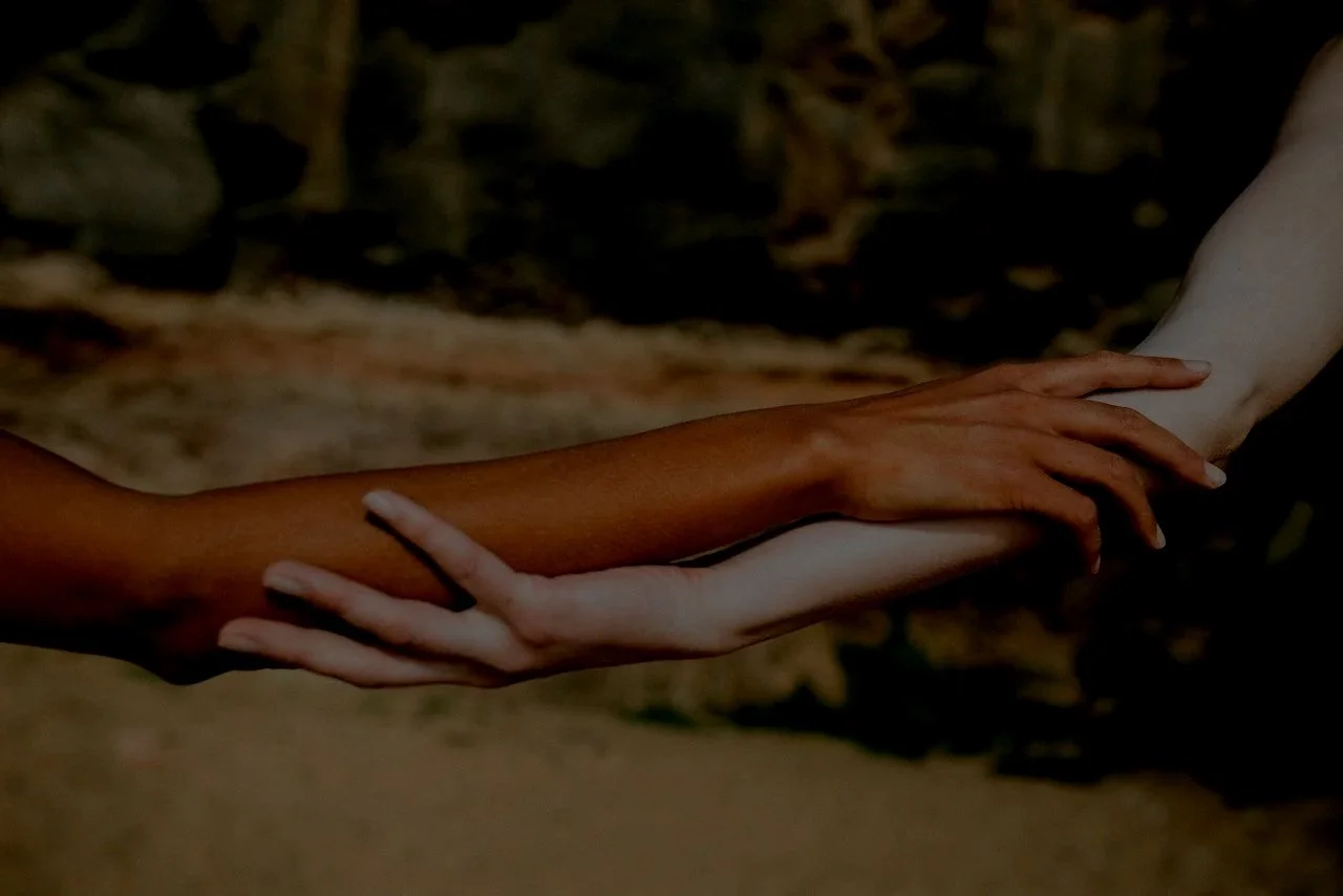 Winnipeg business owner and Winnipeg personal assistant hold arms after the personal assistant planned and organized a dinner party where she hired a private chef and managed the operations of the evening