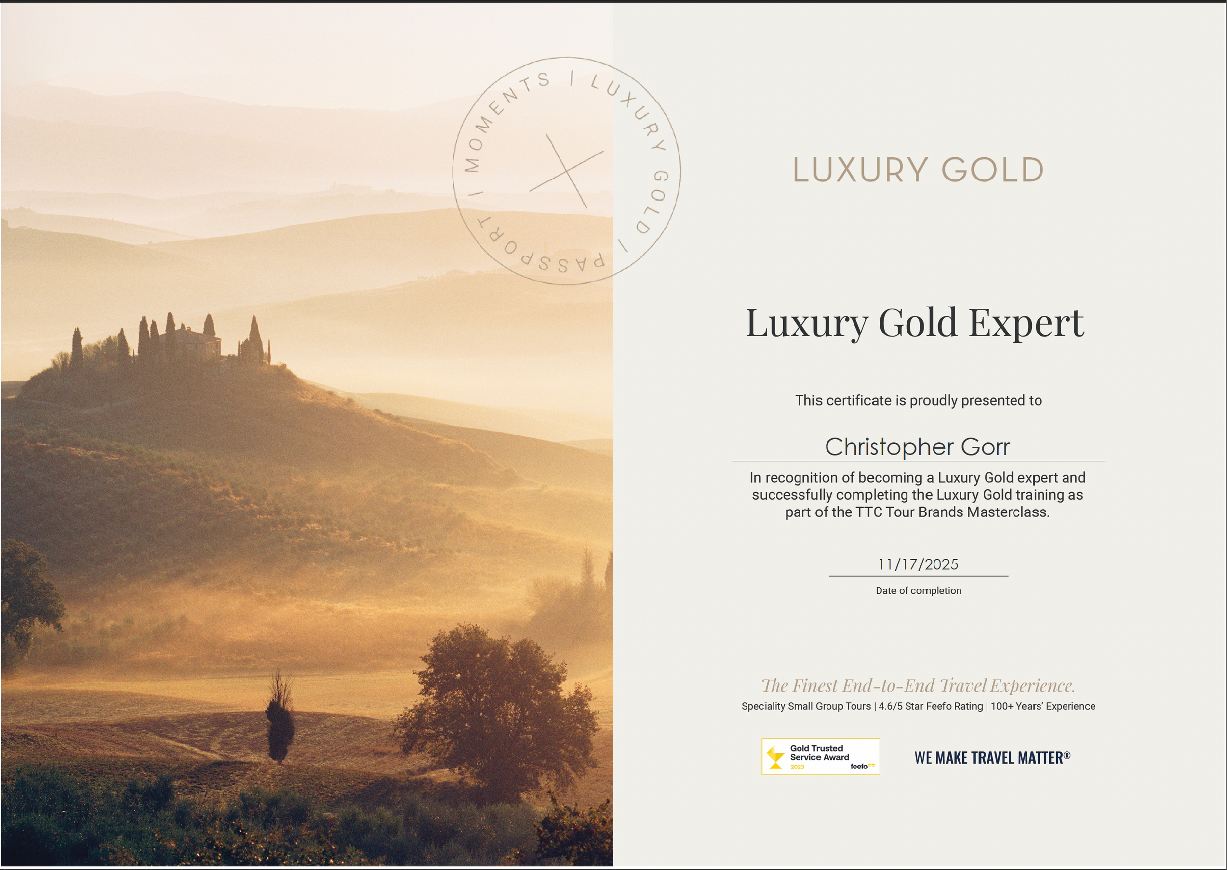 A certificate titled "Luxury Gold Expert" awarded to Christopher Gorr, featuring a scenic landscape of rolling hills and a distant house surrounded by cypress trees, with text details about the certification and a gold award badge.