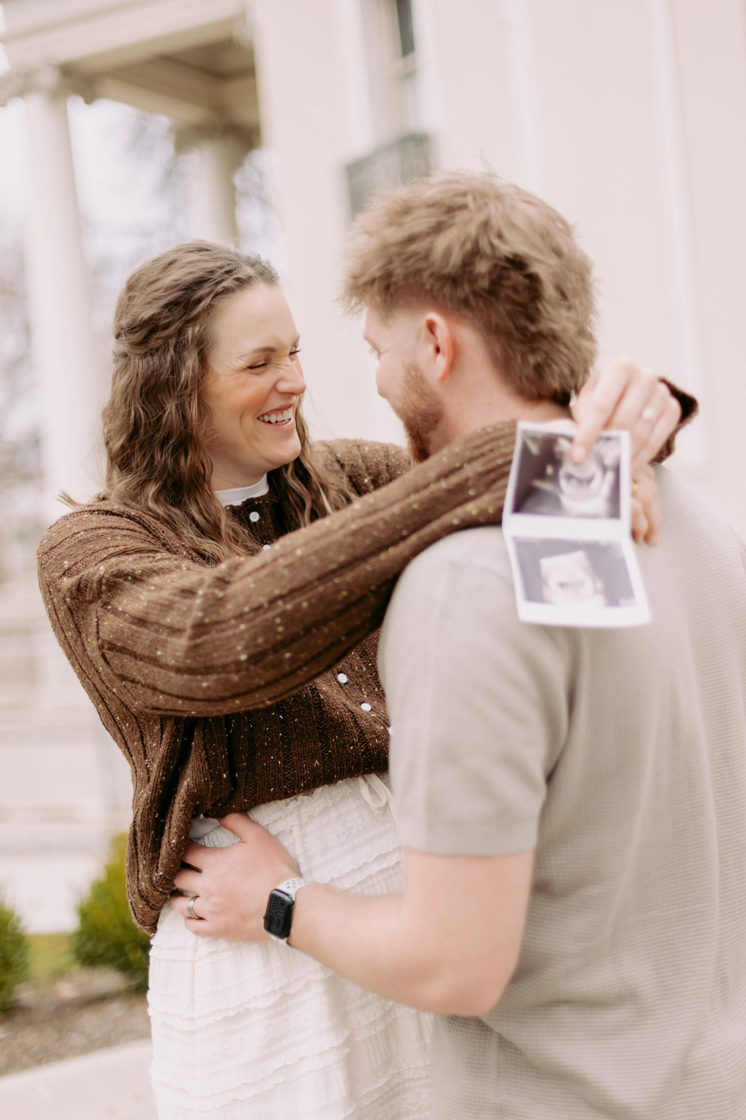 Baby announcement photo. couple outside. Taken by Charlie Rose Photography