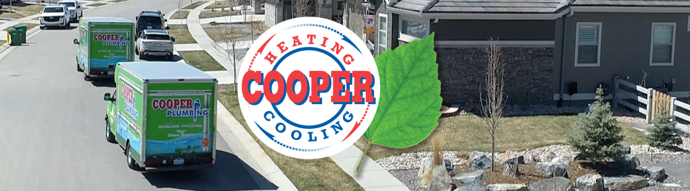 Row of green plumbing service trucks on a suburban street with a house and landscaped yard nearby, featuring the Cooper Plumbing logo with a green leaf.