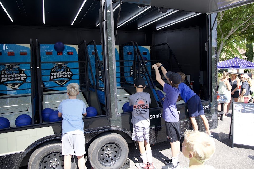Hoop Orlando: Elevate Your May Events with a Mobile Arcade Basketball Trailer