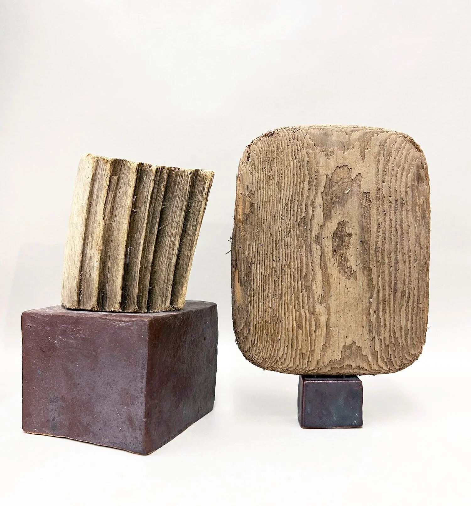  Untitled, 2022 (left)  Wood and ceramic  8 × 4 × 4 inches    Studio #33, 2018 (right)  Wood and ceramic  9 × 6 × 6 inches 