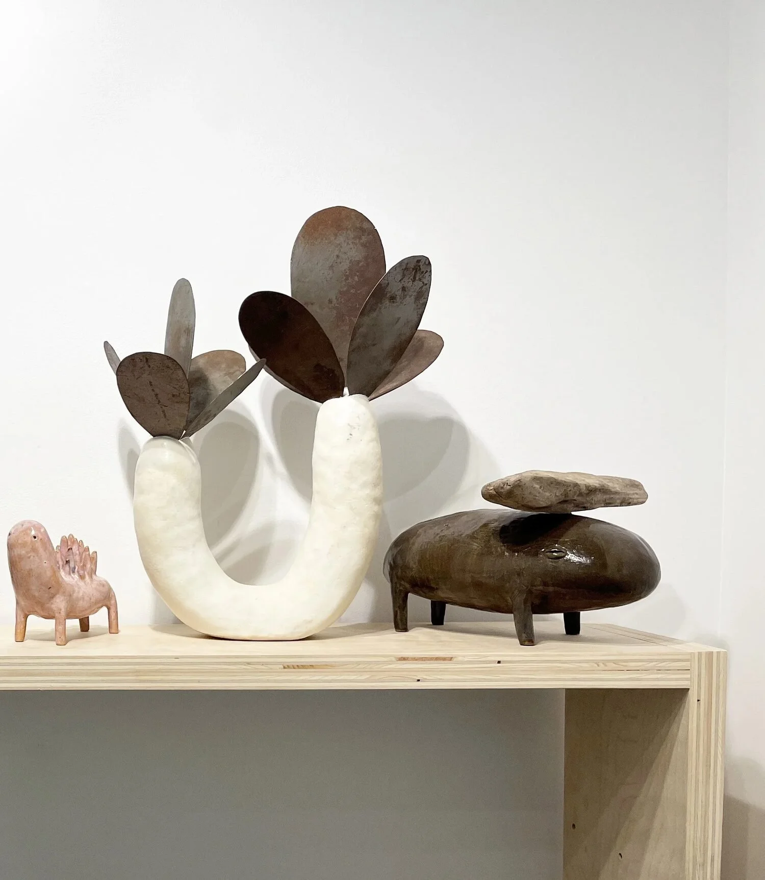  Installation View    Untitled, 2023 (center)  Ceramic and metal   19 × 9.5 × 15 inches    Fauna #6, 2023 (right)  Ceramic and wood  8 × 11 × 13 inches 