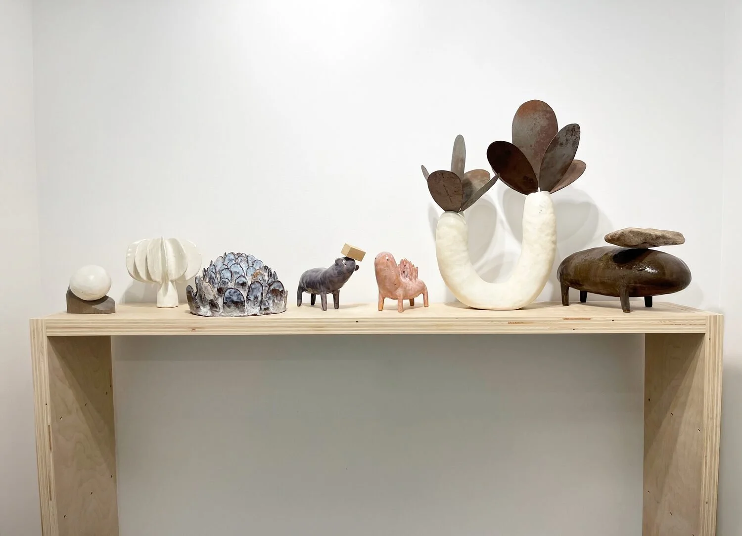  Installation View    Studio #40, 2024 (left)  Ceramic and wood  4 × 3.5 × 5 inches    Flora #30, 2022  Glazed ceramic  7.5 × 7 × 7 inches    Untitled, 2023  Glazed ceramic  5.5 × 10 × 8 inches 
