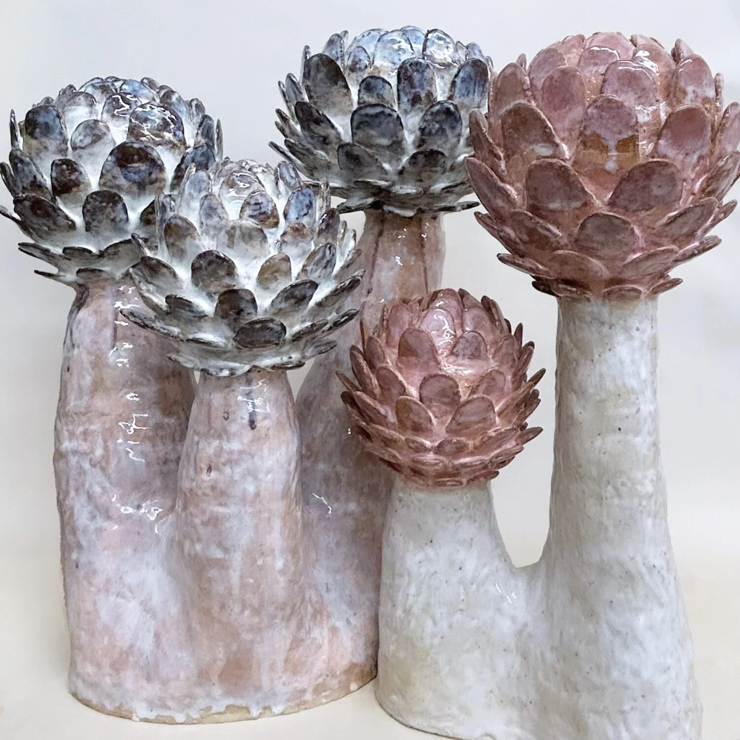  Flora, 2023 (left)  Glazed ceramic  21 × 17 × 15 inches    Flora #14, 2023 (right)  Glazed ceramic  19 × 12 inches 