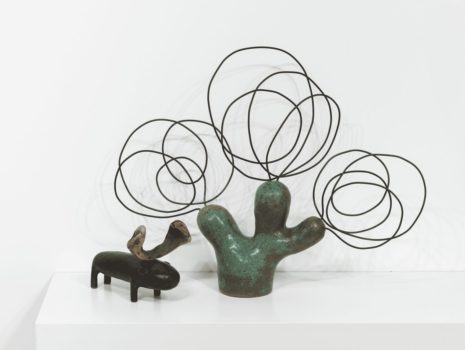  #33, 2023 (left)  Glazed ceramic and wood  5.11 × 6.6 × 4.7 inches    #50, 2023 (right)  Glazed ceramic and wire  15 × 18.5 × 3 inches 