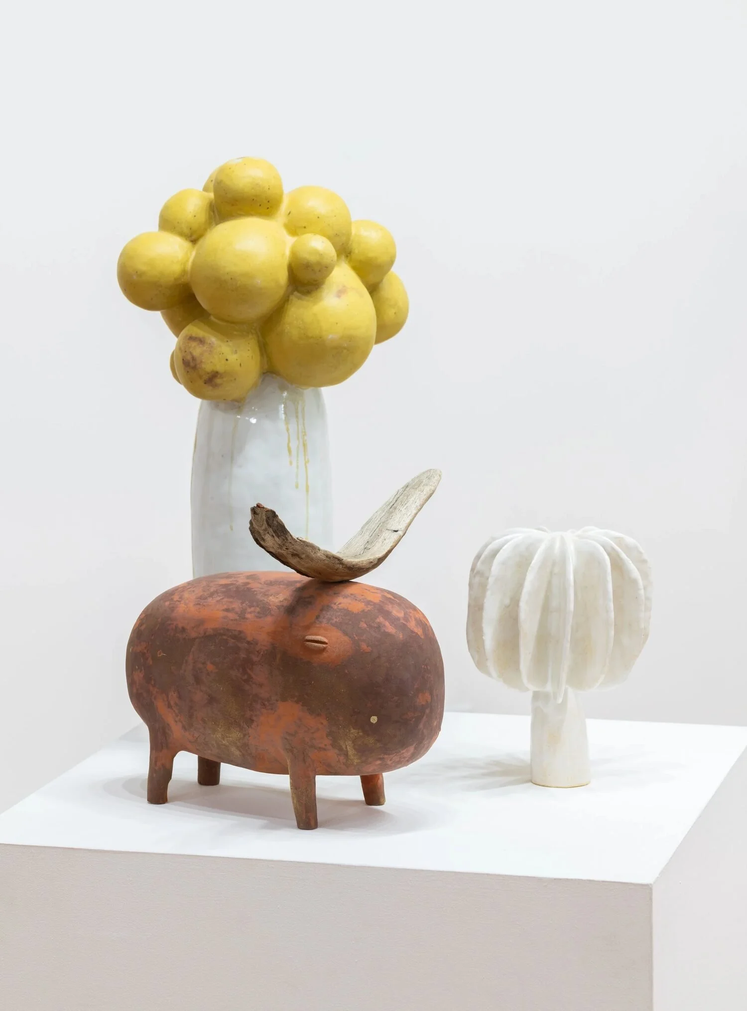  #42, 2022 (top left)  Glazed ceramic  23 × 11.5 × 9.5 inches    #60, 2021 (bottom left)  Glazed ceramic and wood  11.8 × 12.5 × 12.9 inches    Untitled, 2022 (right)  Glazed ceramic  9× 6.5 × 6.5 inches 