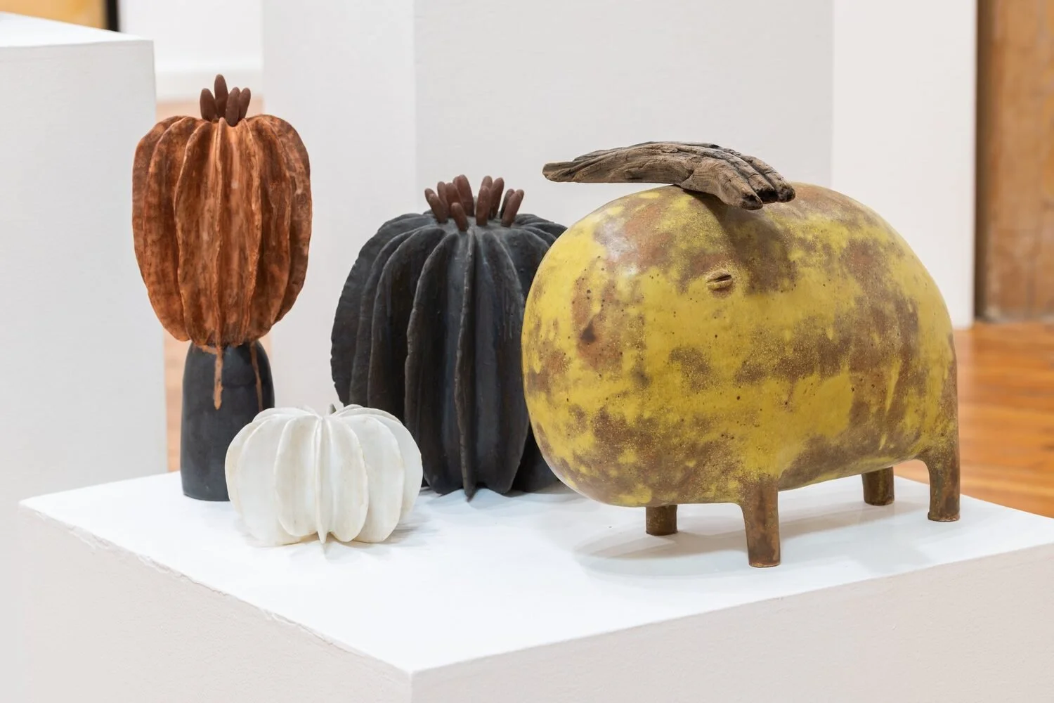  #59, 2023 (left)  Ceramic  13.3 × 5.5 × 5.5 inches    #55, 2023 (center)  Ceramic  9.4 × 9 × 8.2 inches    #54, 2023 (left)  Glazed ceramic and wood  11.8 × 15 × 11.5 inches 